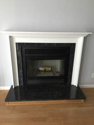 Wood Fireplace + Granite + Mantel