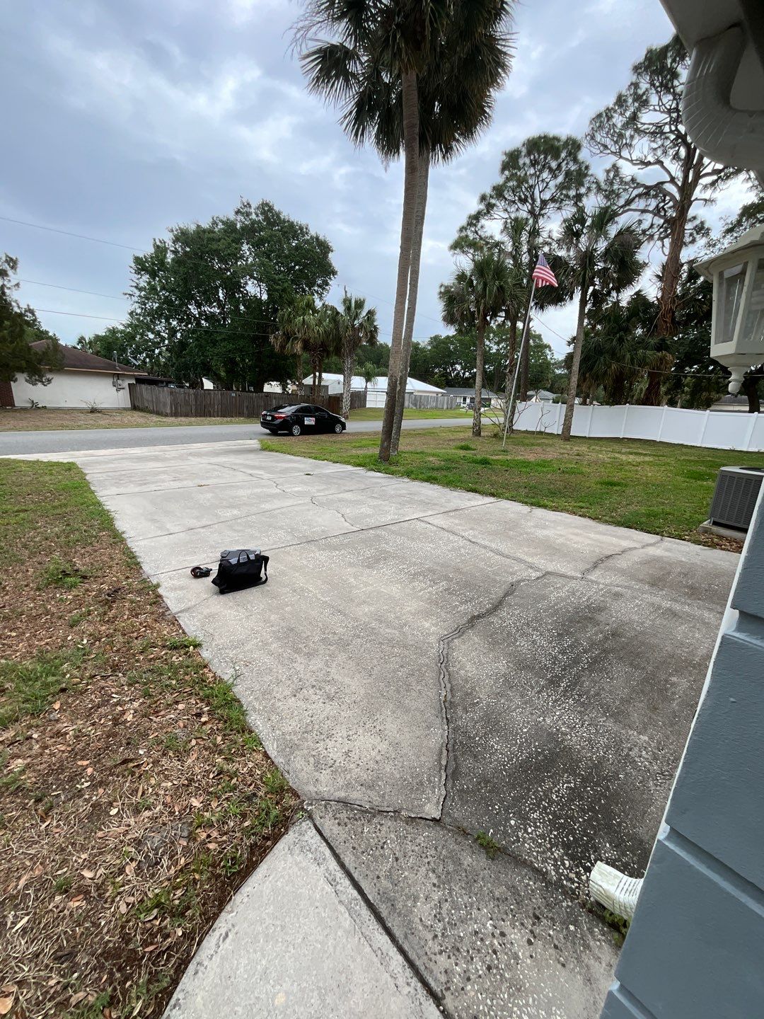 Driveway and Garage using Tidal Wave by Amvet concrete coatings llc