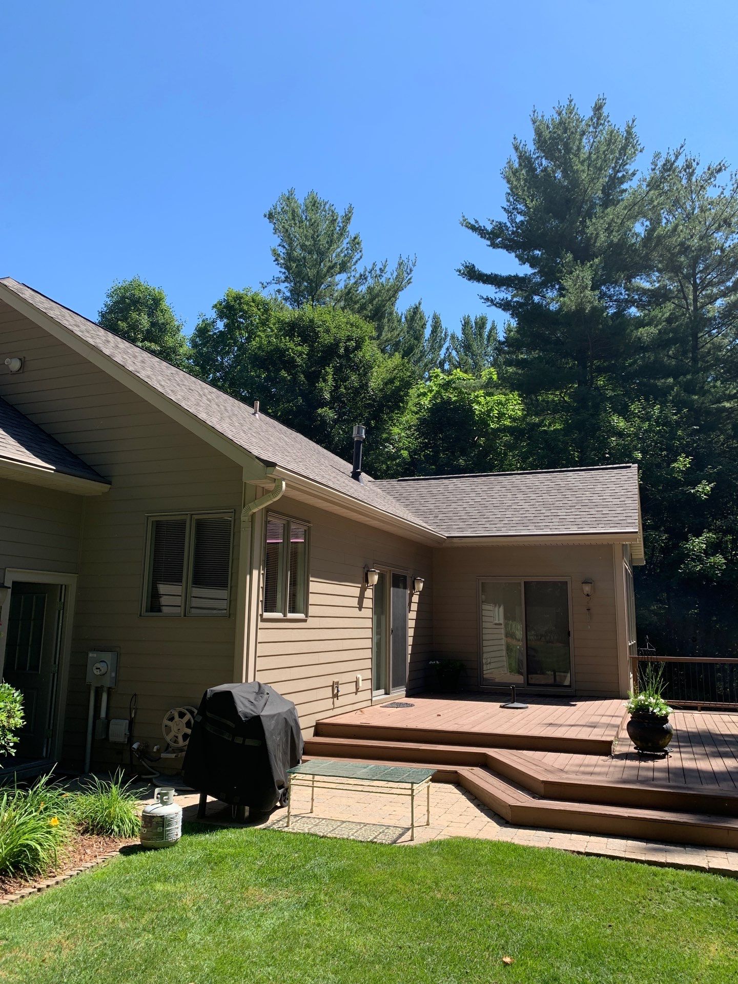 Gutter Helmet Installation on a Multi-Level Traverse City Residence by Rainbow Seamless Systems