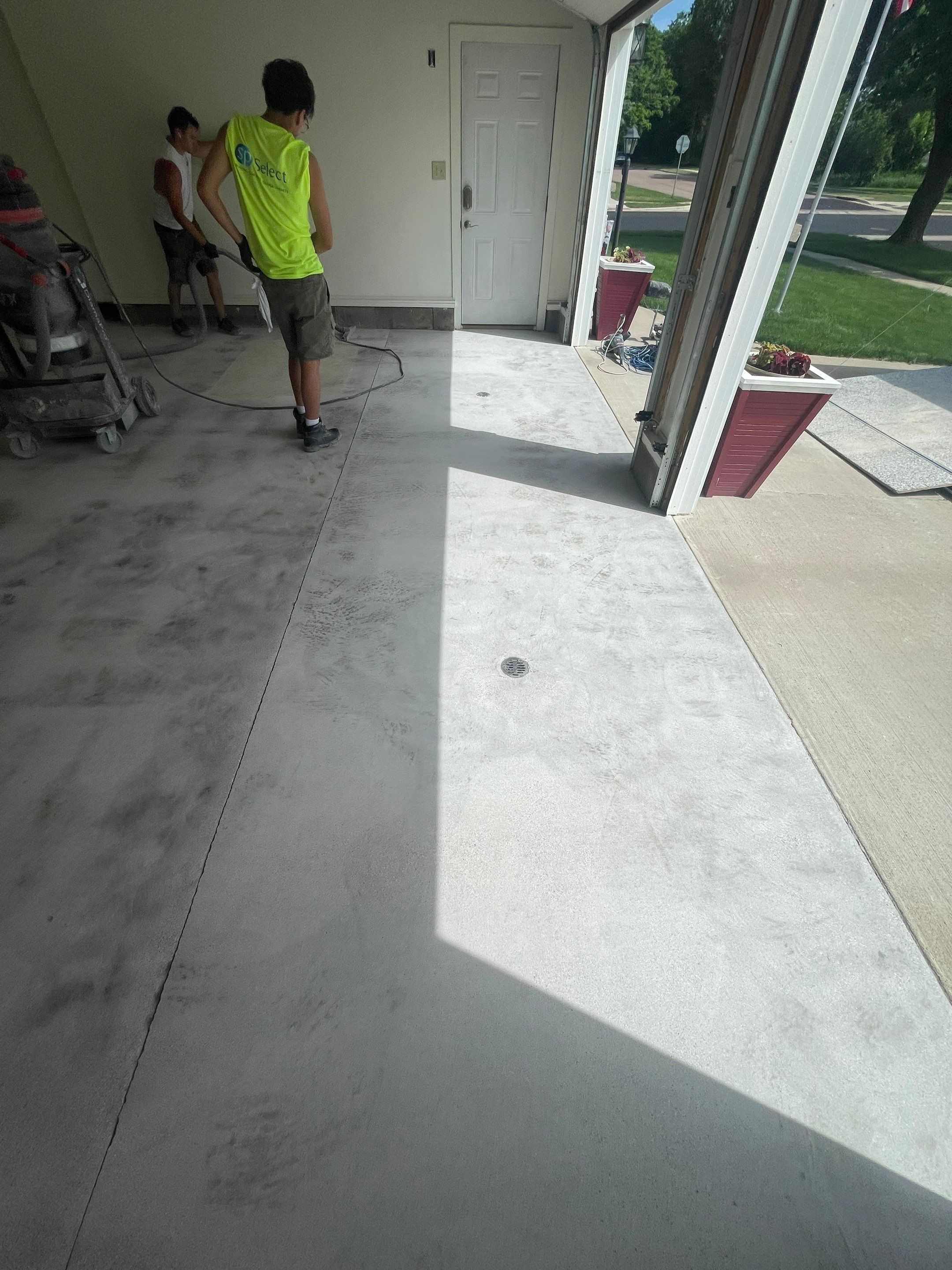 Madison Garage Concrete Coating with Feather Grey Speckle Finish by Select Painting, Coatings & Garage Cabinets