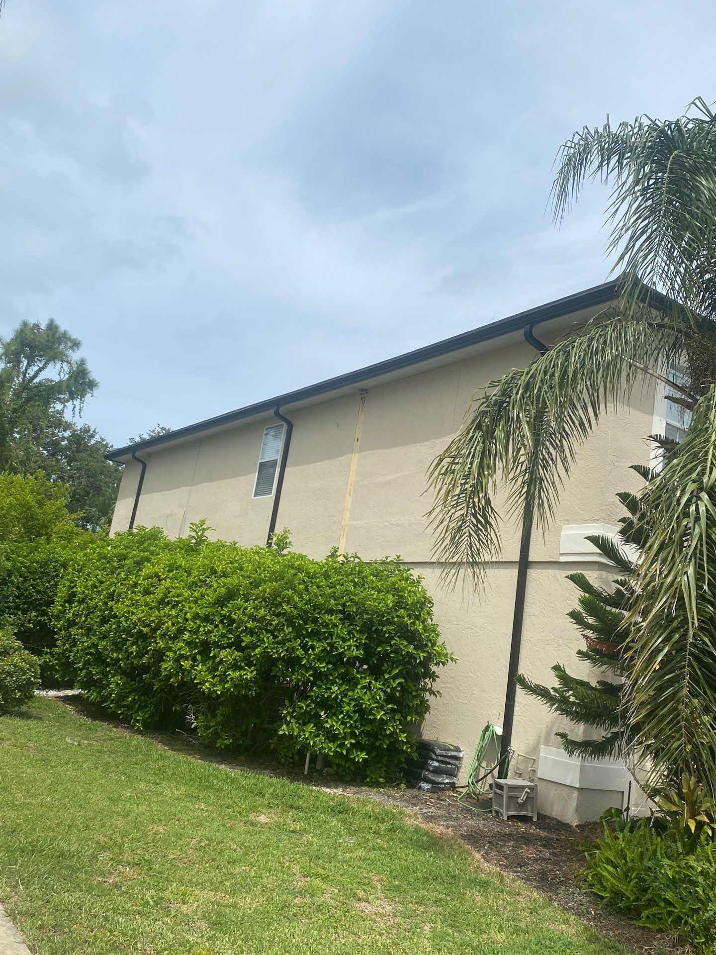Black Seamless Gutters for Modern Homes in Osprey FL by Gutter Professors