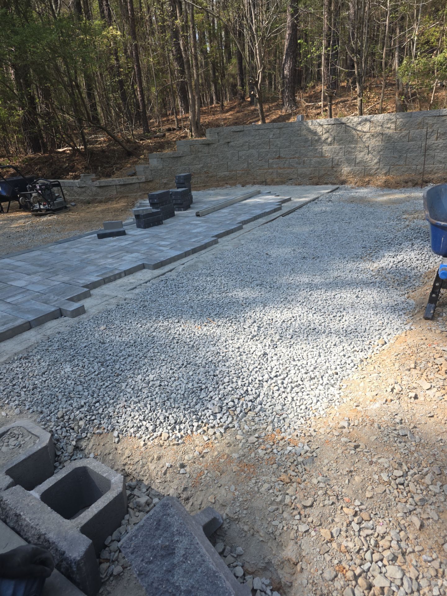 Pittsboro Outdoor Living Transformation – Retaining Wall, Paver Patio & Elevated Deck by Elite Remodeling and Design LLC