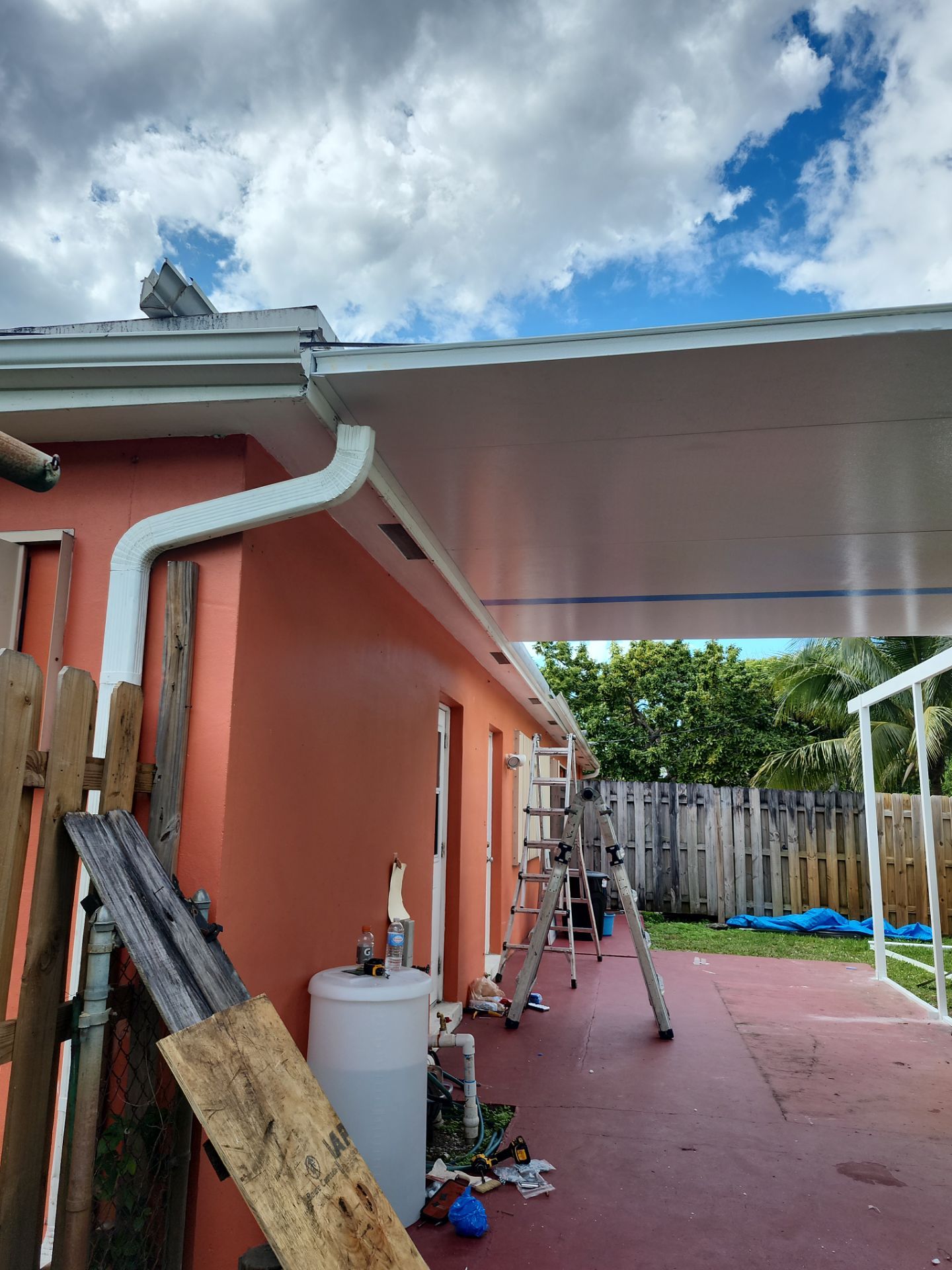 Insulated Screen Enclosure and Wood Tile Deck Installation in Plantation by Aastro Roofing