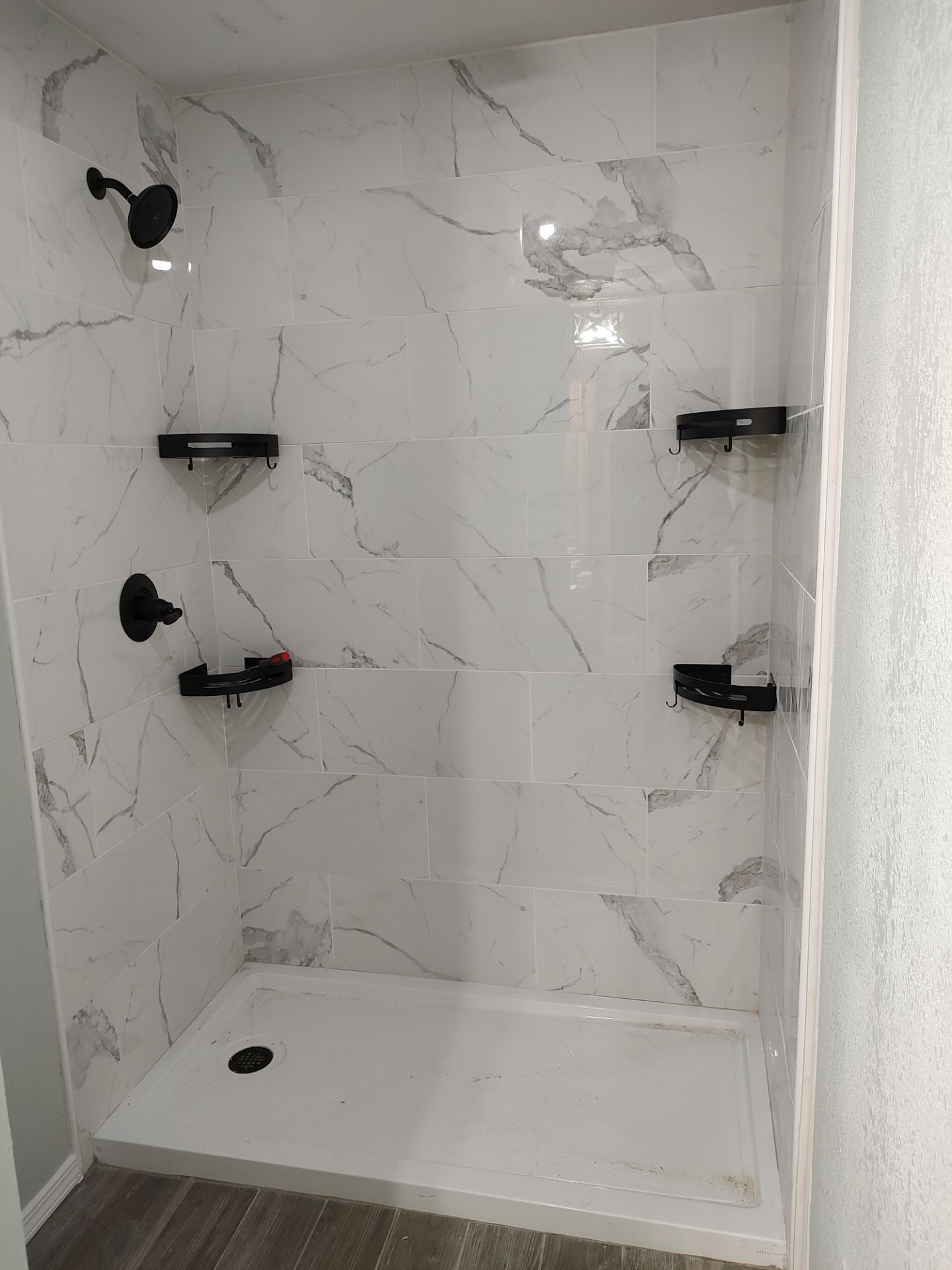 Bathroom remodel w/shower upgrade by In & Out Construction & Remodeling, LLC