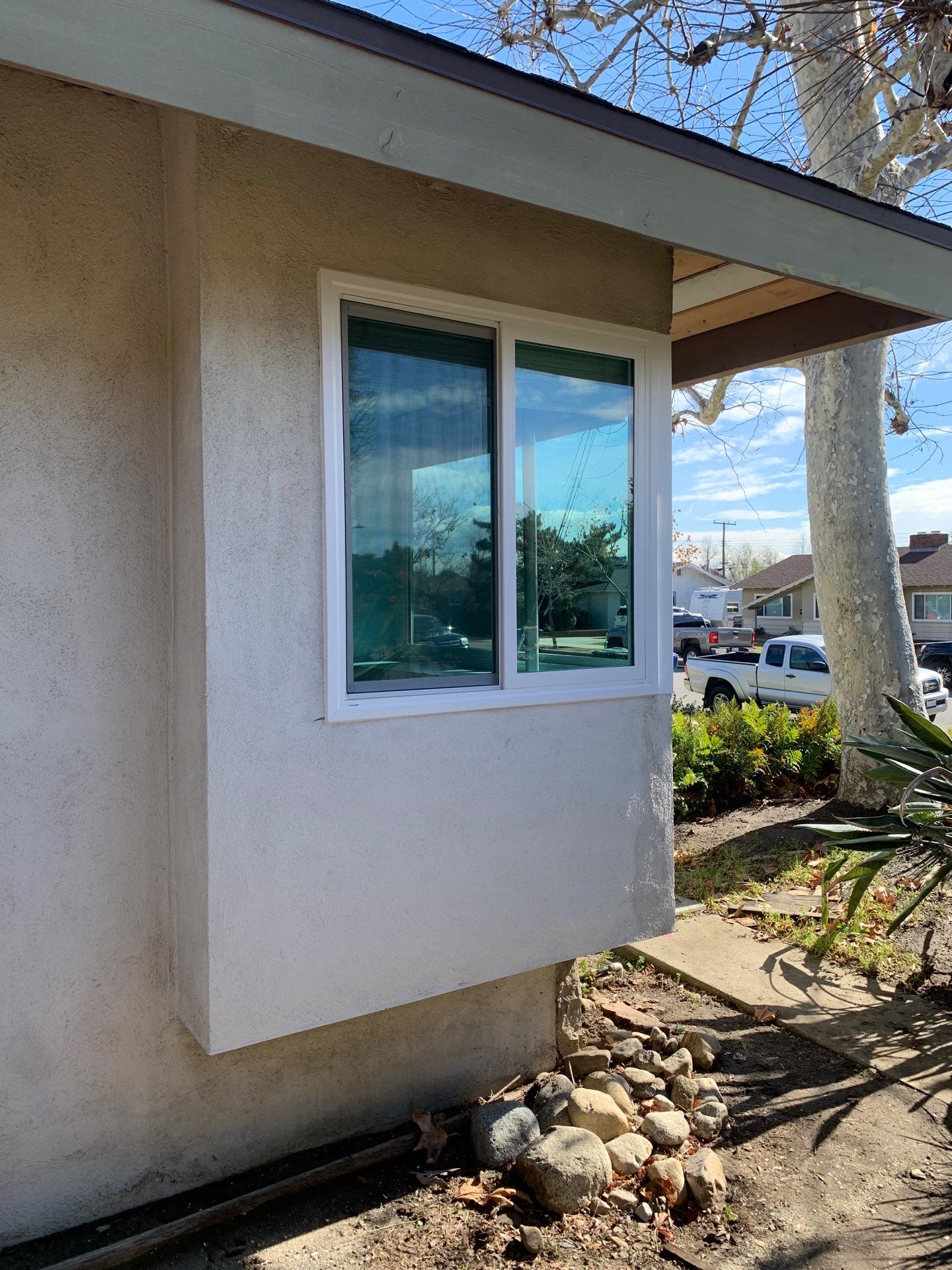 Window Installation using Black Vinyl Windows by American Window Company