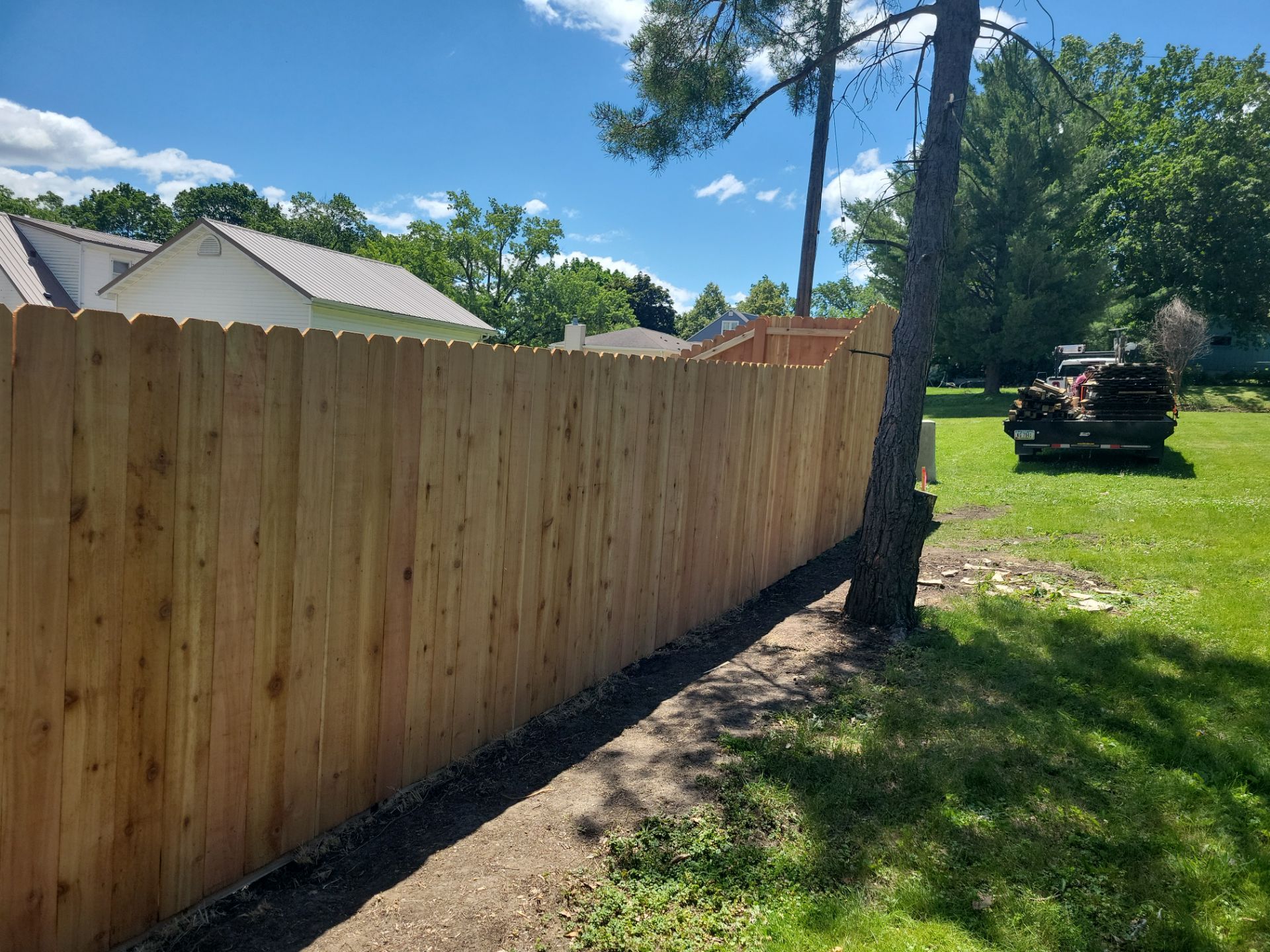 Custom Cedar Unstained Wood Privacy Fence Installation in Cedar Falls by Perfect Picket Fence and Stain