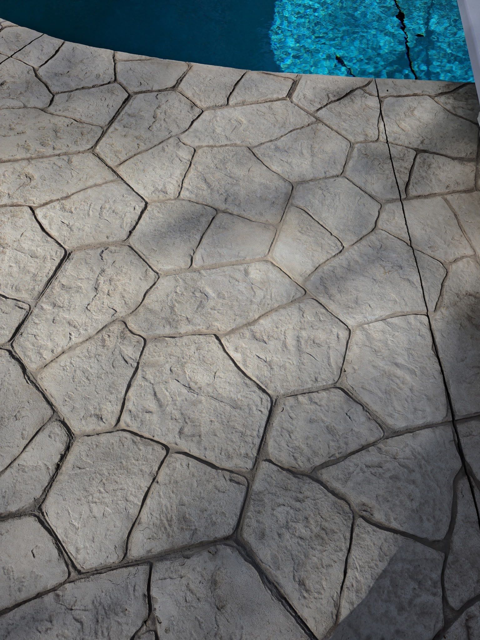 stamped concrete pool deck  by Architectural Concrete Design