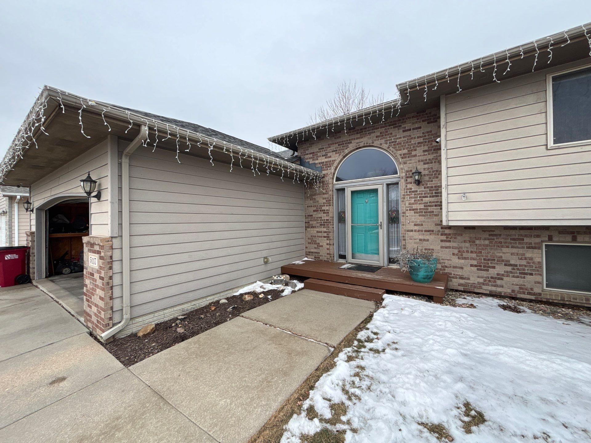 Exterior Painting and Wood Trim Replacement in Sioux Falls by Select Painting, Coatings & Garage Cabinets