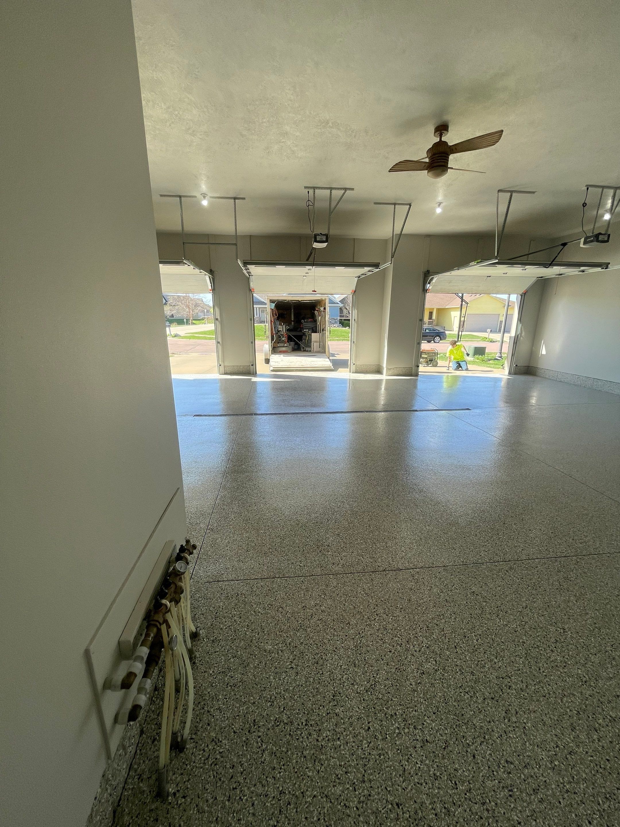 Multi-Car Garage Epoxy Floor Coating in Beresford by Select Painting, Coatings & Garage Cabinets
