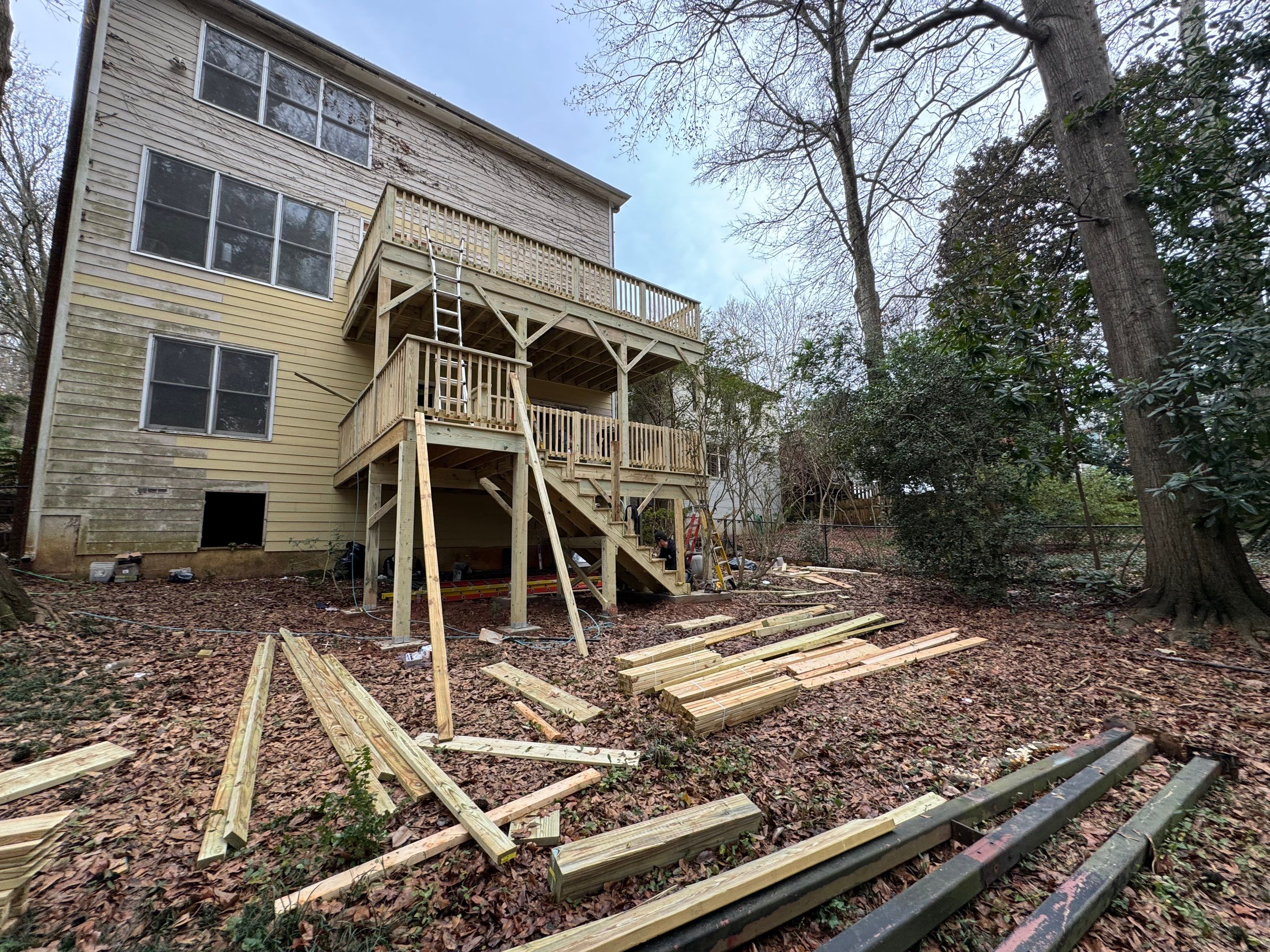 Multi-Level Pressure-Treated Wooden Deck Construction in Decatur by Swift Home Renovations