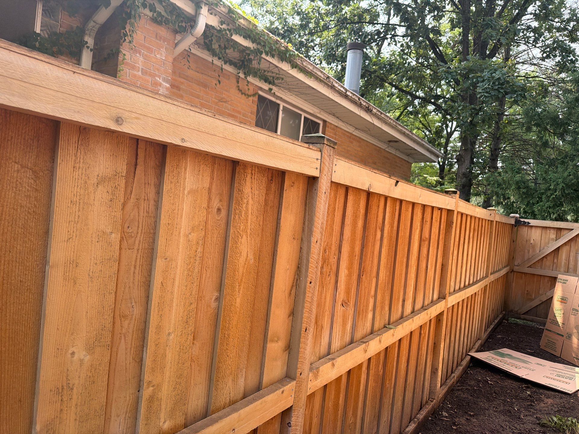 Wood fence cleaning and sealing by Northern Power Washing LLC.