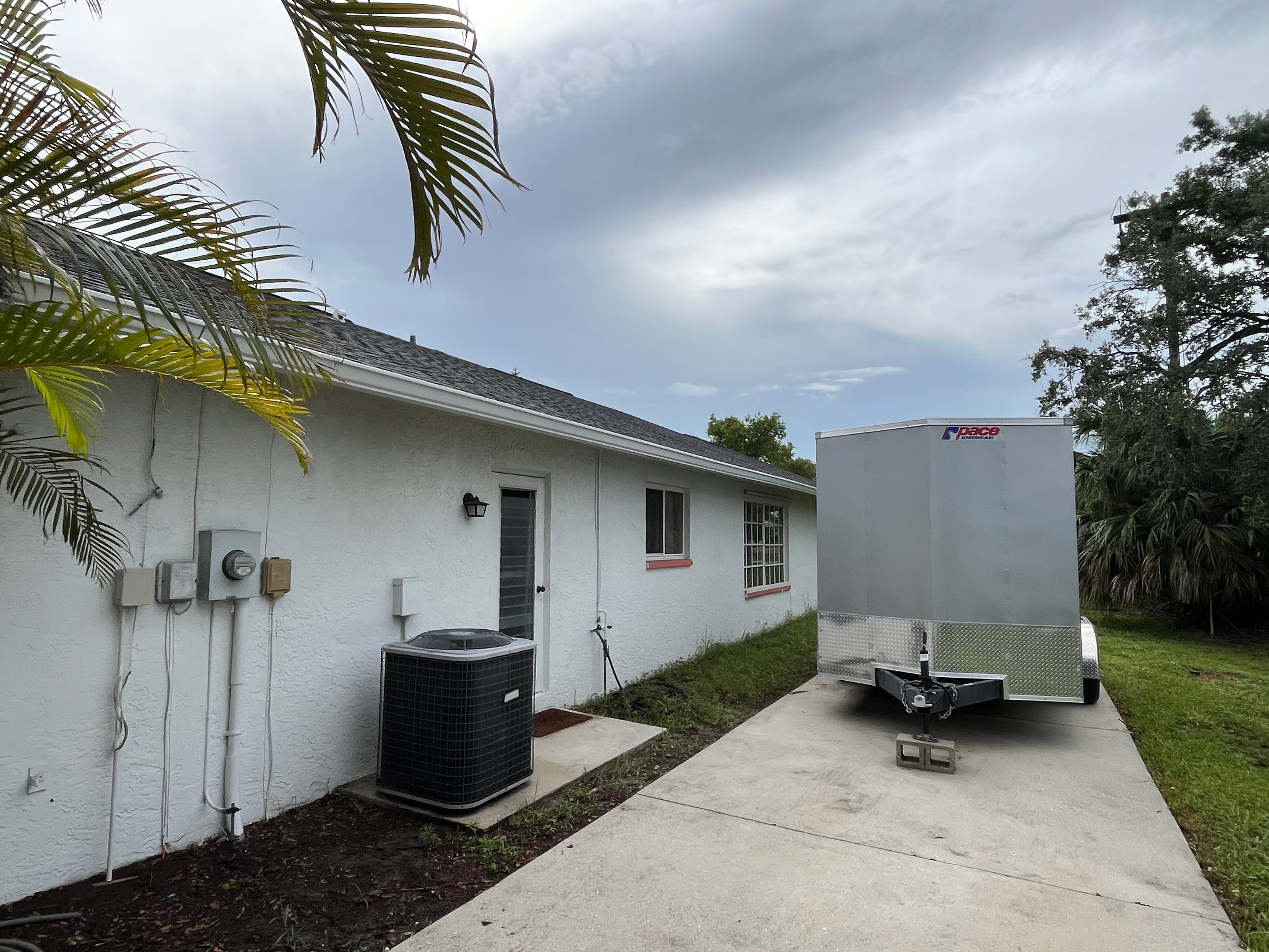 White Seamless Gutters with Splash Guards in North Fort Myers FL by Gutter Professor   by Gutter Professors