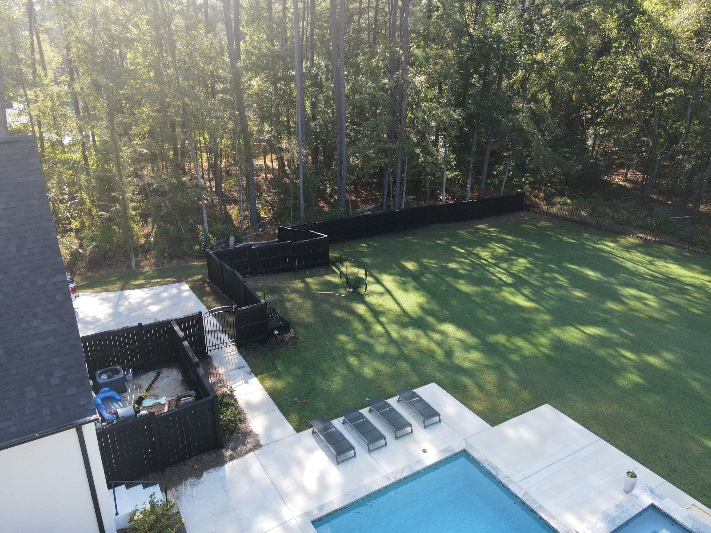 Fence Stain using Wood Defender Black  by Roberson Construction LLC