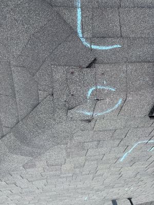 Chalk markings on an architectural asphalt shingle roof