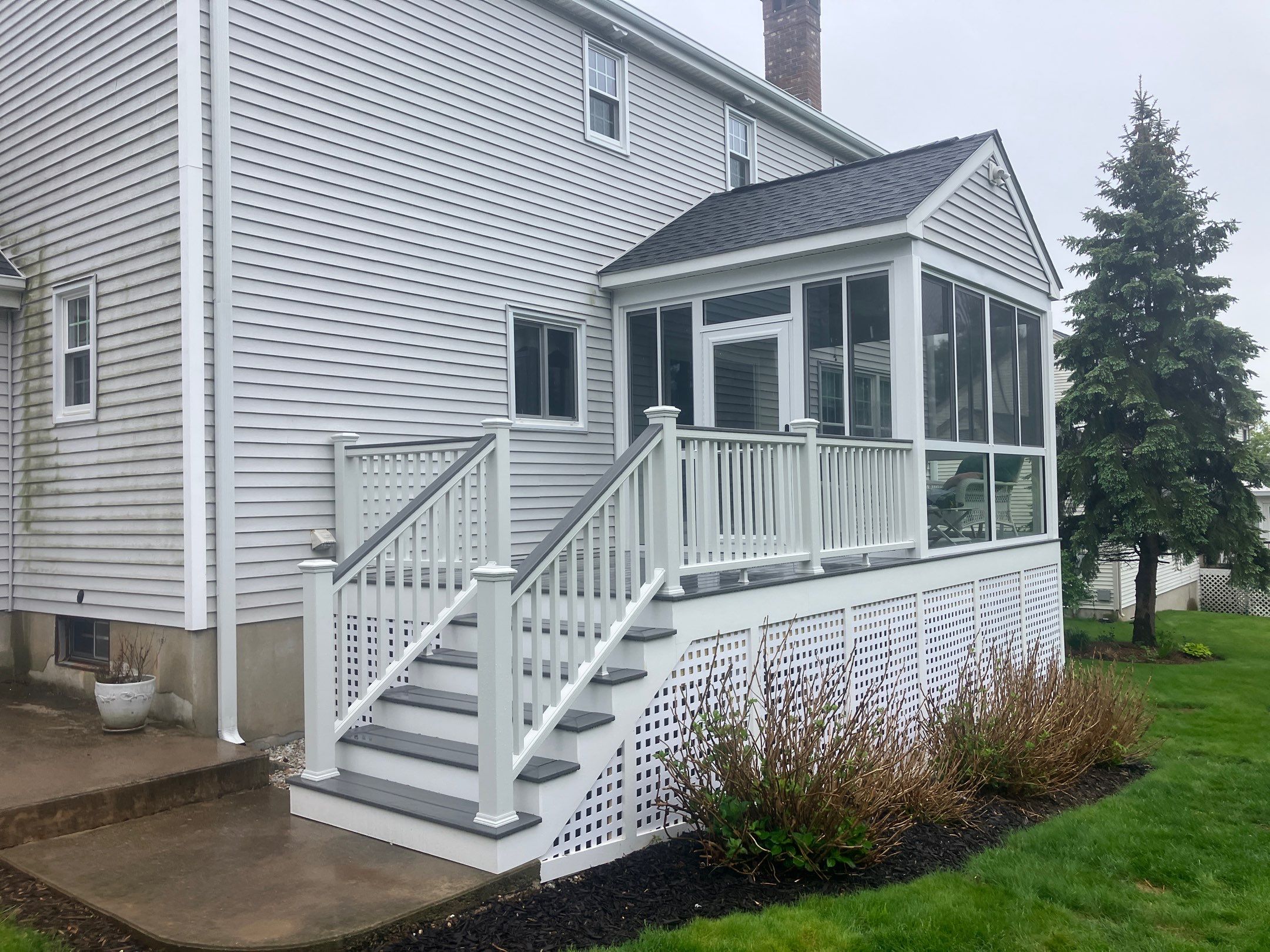 Summer Space Porch Enclosure Transformation by DiGiorgi Roofing and Siding Inc