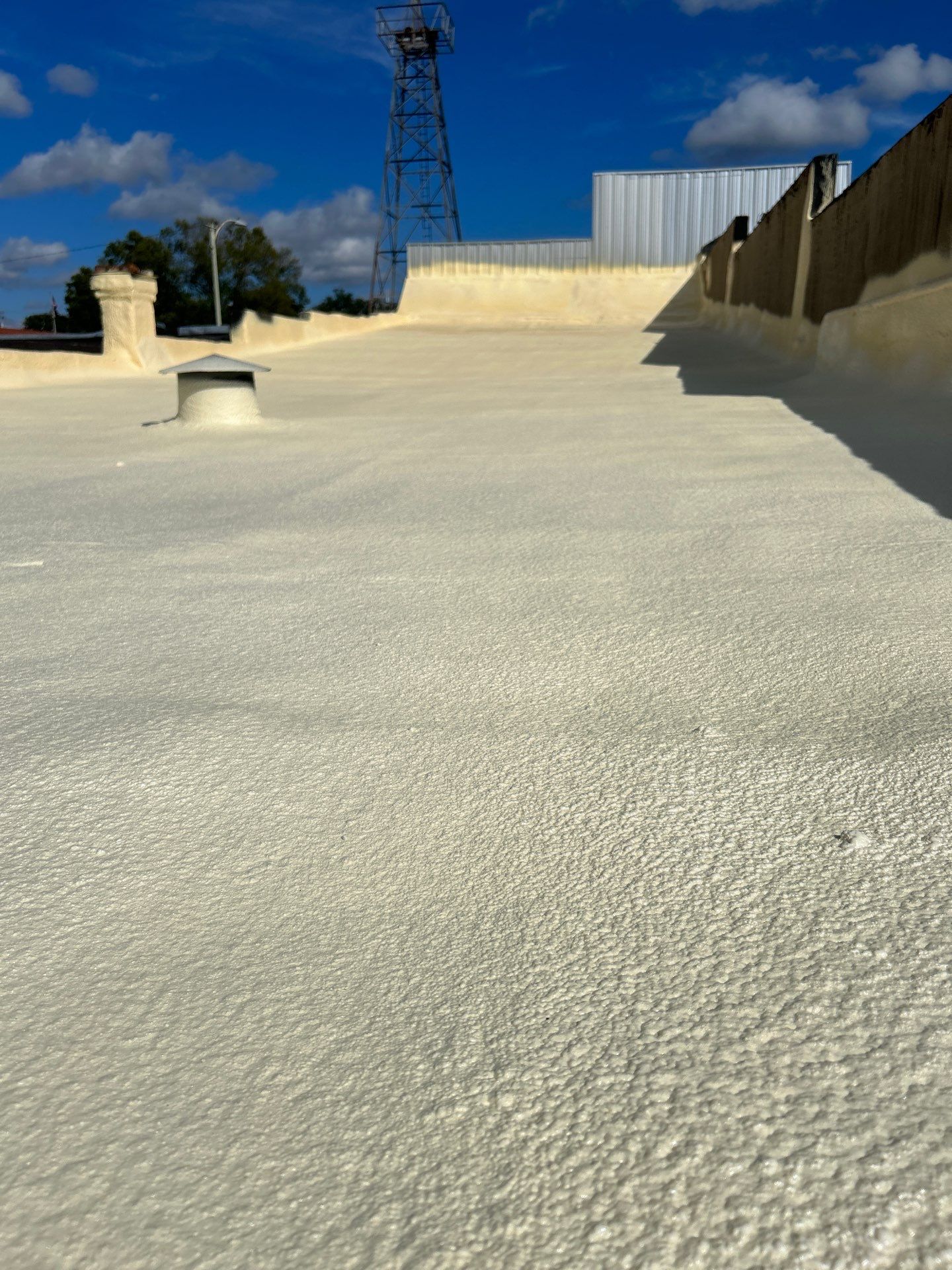 Downtown Gladewater Commercial Foam Roof Restoration – SPF + High-Tensile Acrylic by All Star Roofing LLC
