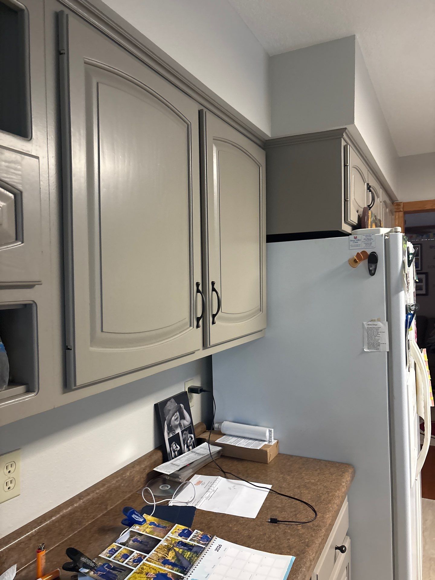 Kitchen Cabinet Painting and Hardware Update in Sioux Falls by Select Painting, Coatings & Garage Cabinets