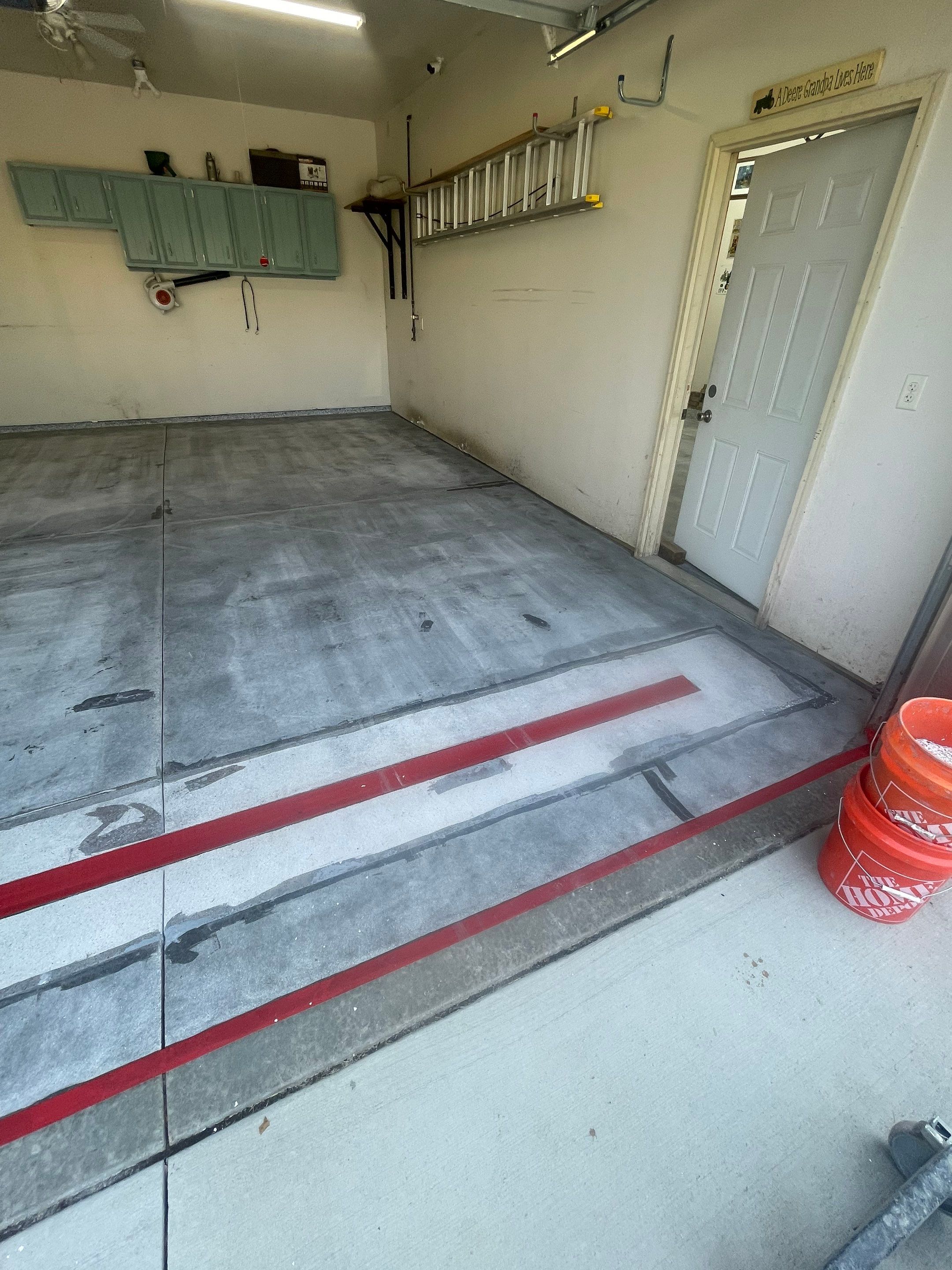 Multi-Stall Garage Floor Coating Installation in Sioux Falls by Select Painting, Coatings & Garage Cabinets