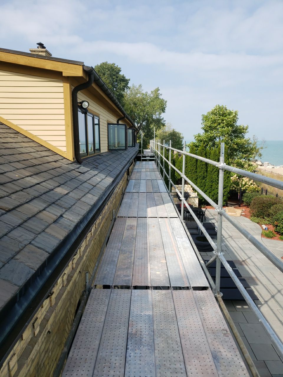 Slate Roof Replacement and Half Round Copper Gutter Installation by Custom Installations