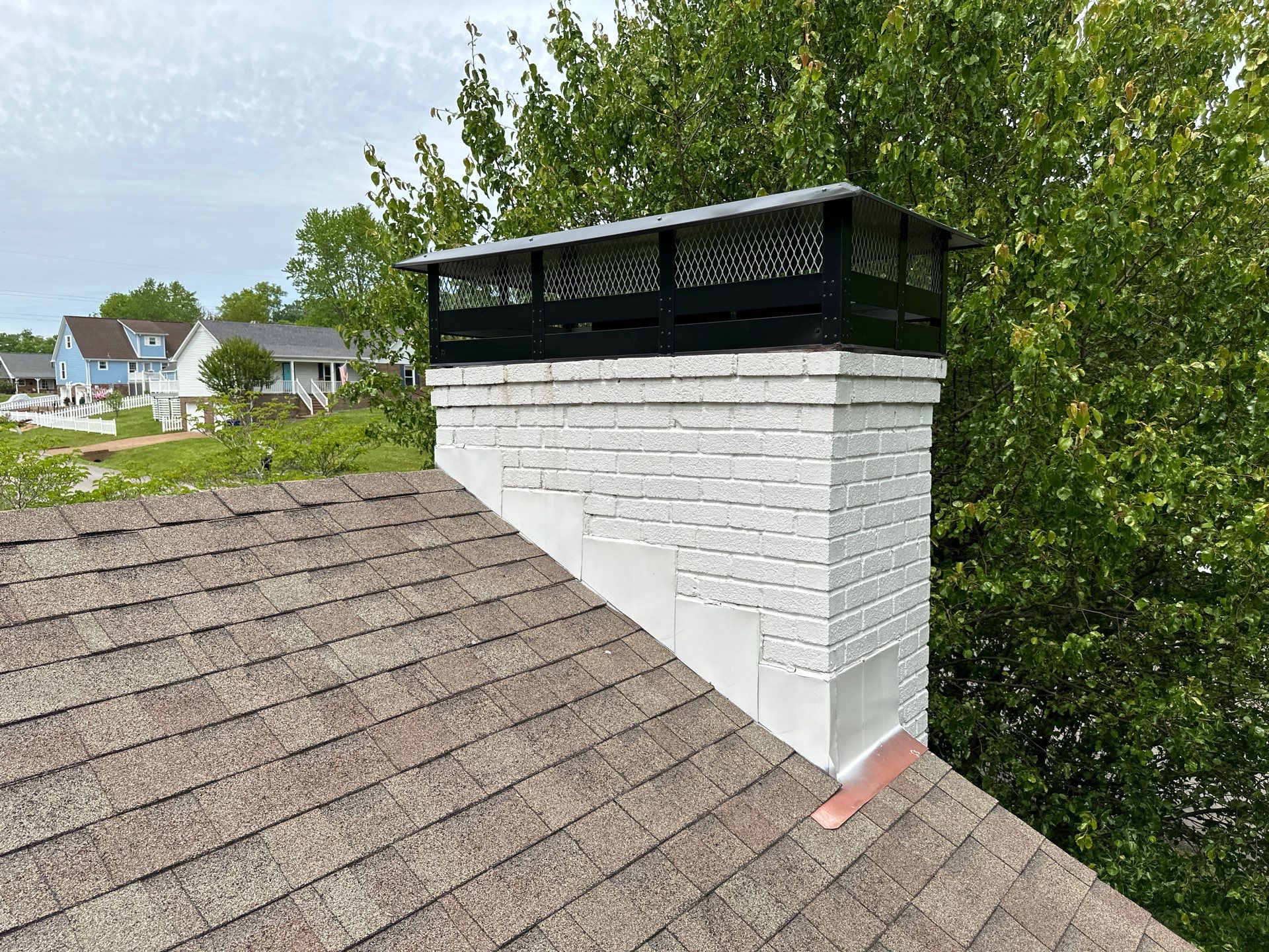 Residential Roofing Repair using Custom Fabricated Chimney Cap by Paragon Roofing
