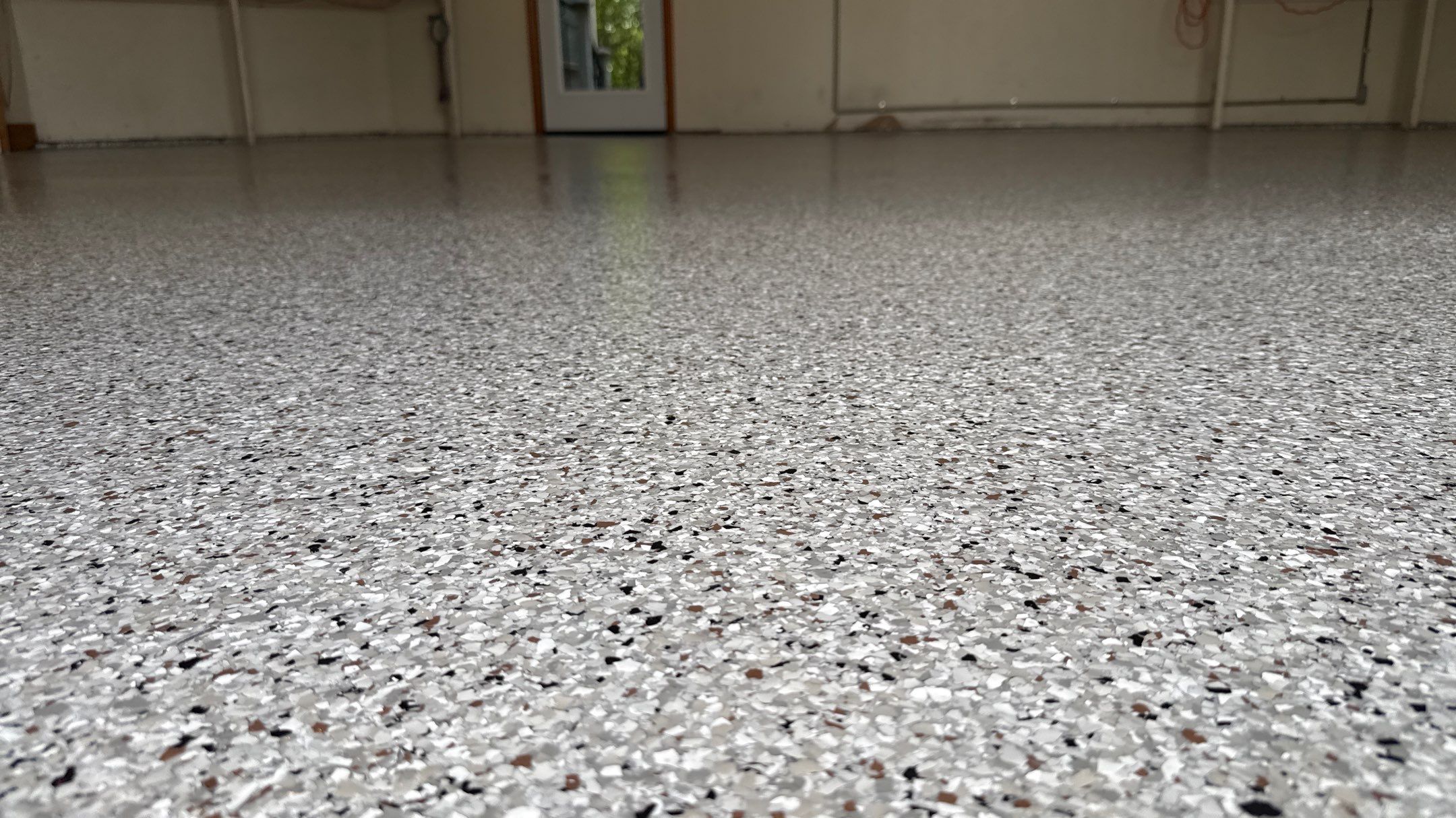 The Perfect Day To Install A Beautiful Coyote Flake Floor by Banner Garage
