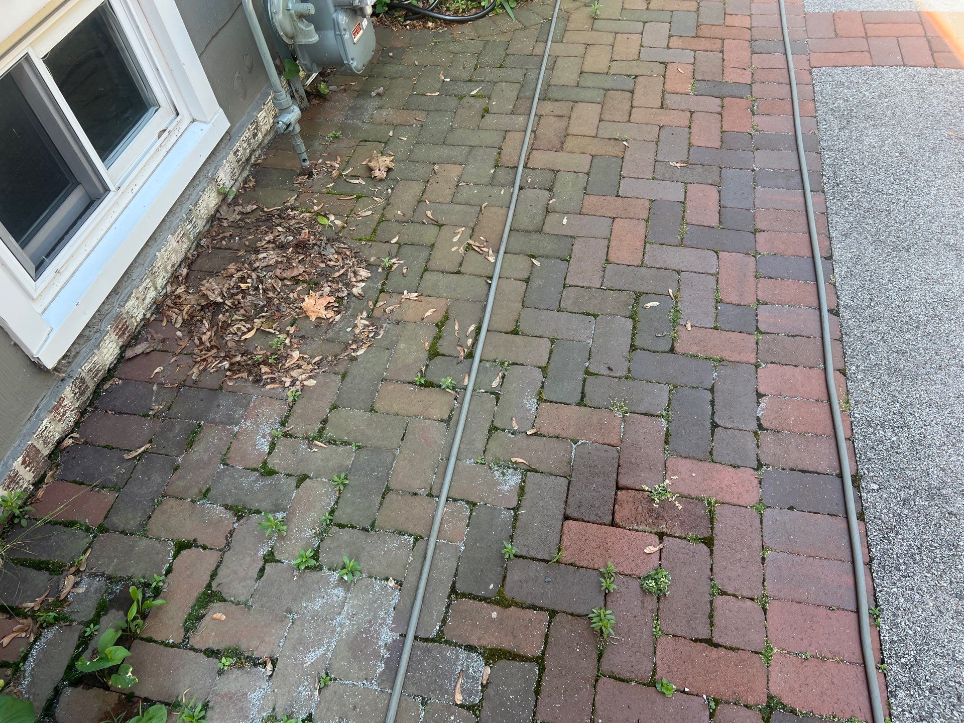 Brick paver cleaning and sealing by Northern Power Washing LLC.