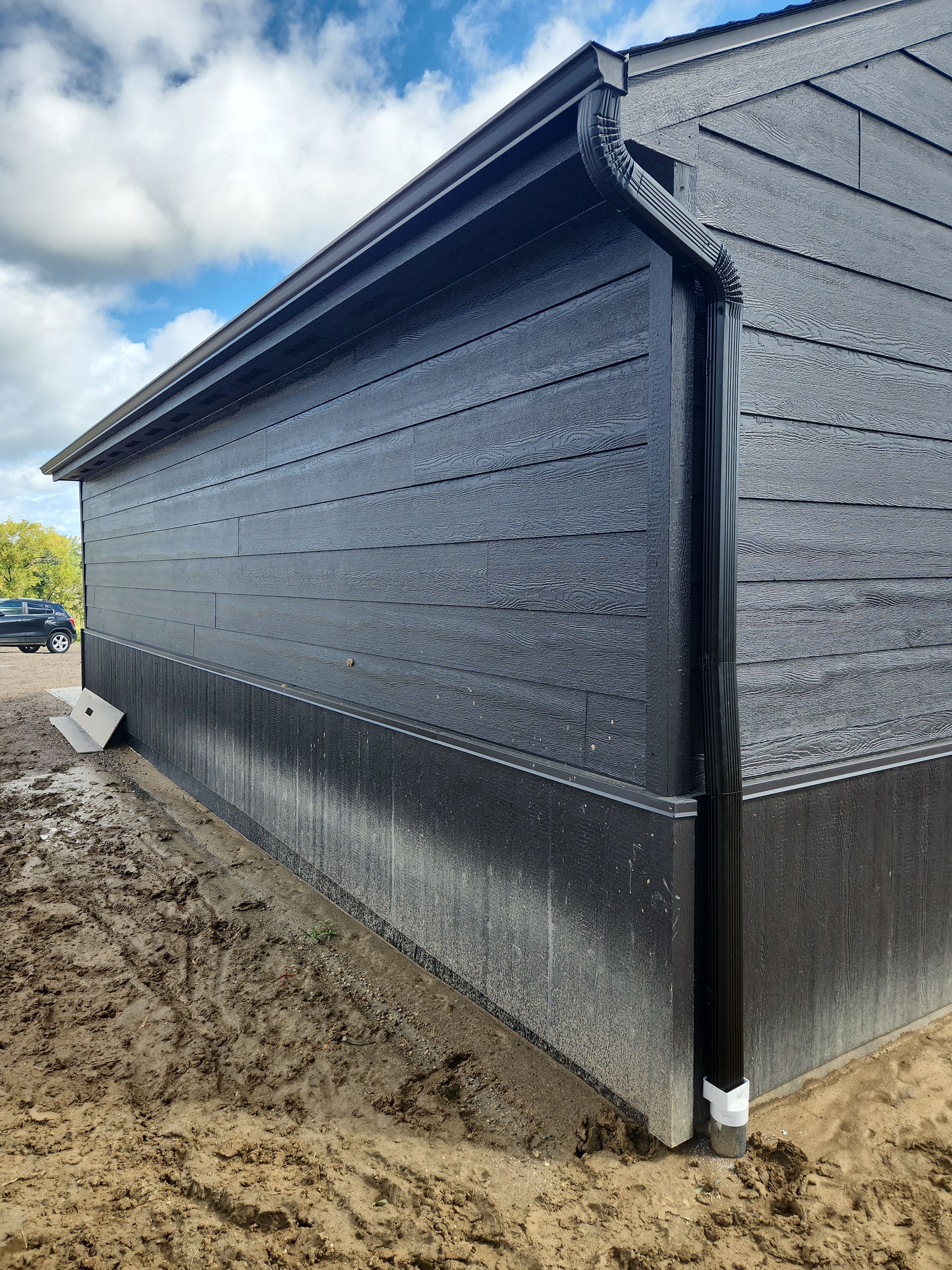 Black Seamless Gutters in Buffalo, MN by Next Level Seamless Gutters / Exteriors Inc.