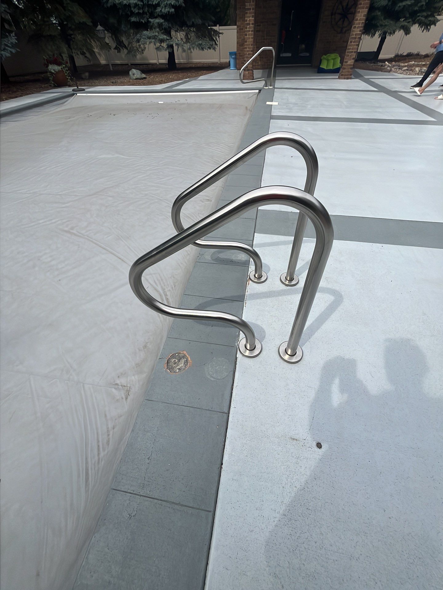Decorative Concrete Pool Deck and Patio Resurfacing in Sioux Falls by Select Painting, Coatings & Garage Cabinets