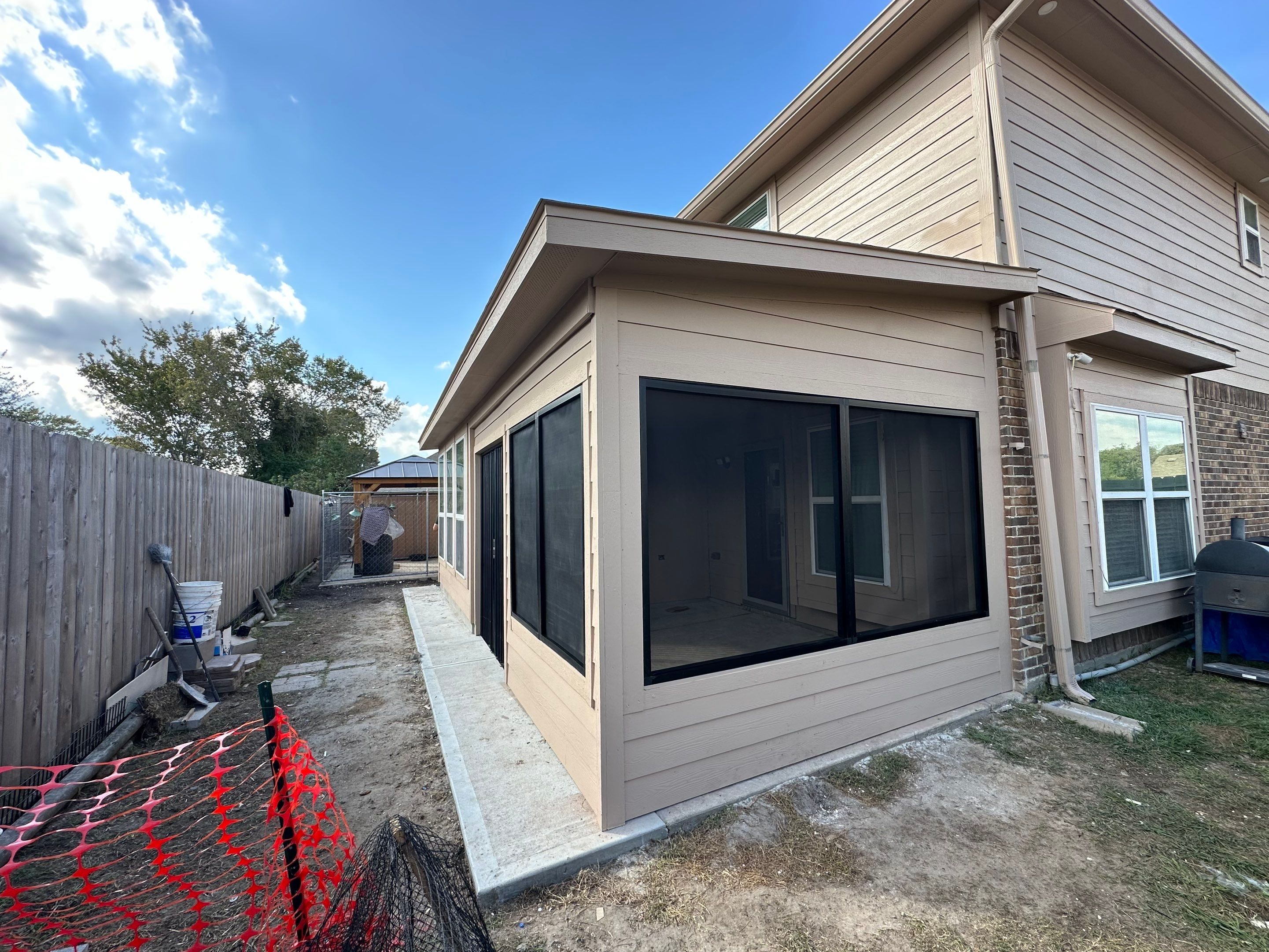 Project Case Review: Sunroom Addition, Patio Integration & Drainage Upgrade by Texas Urban Elements