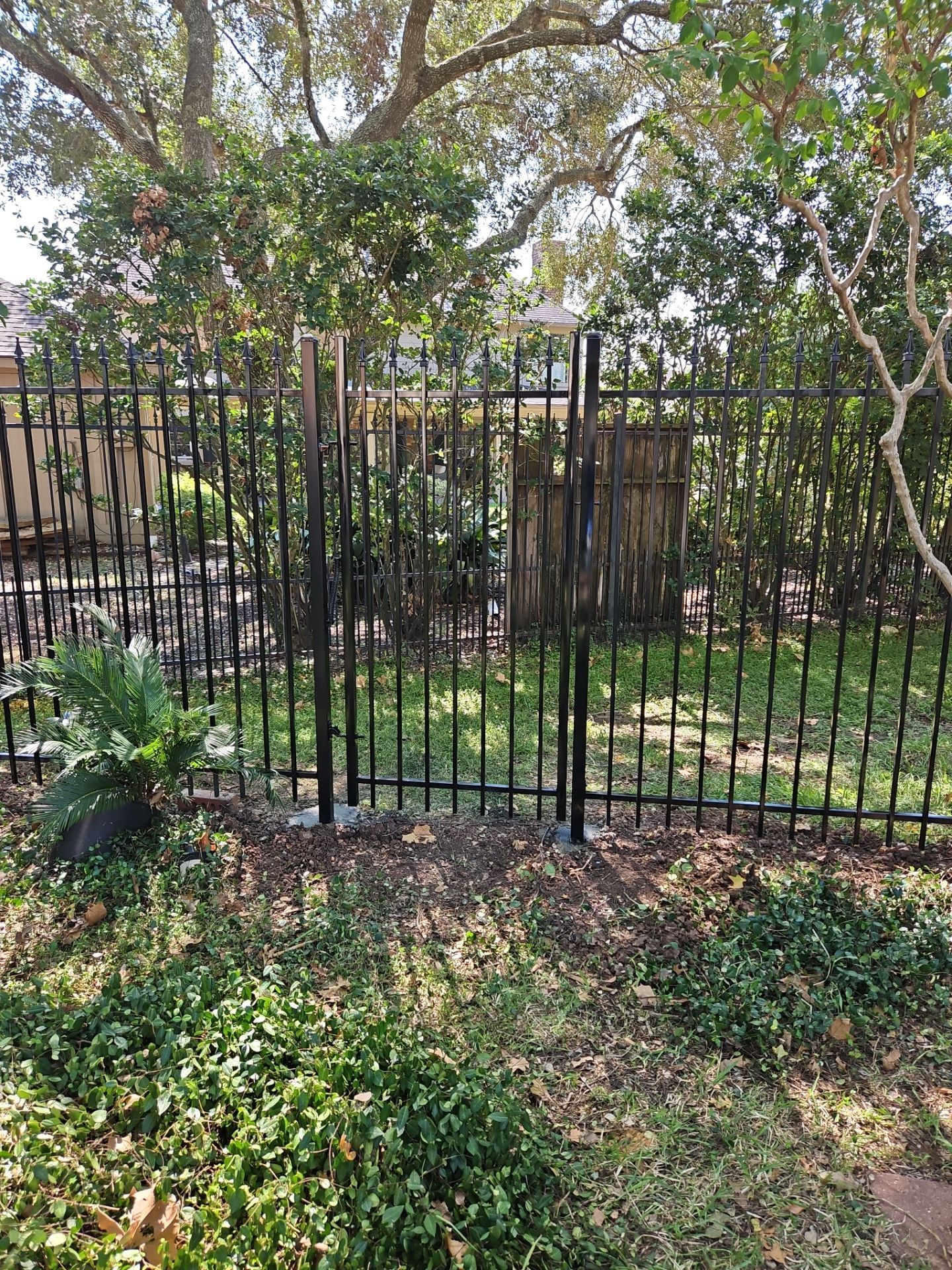 Iron fence installation using LION iron panel - 2 Rail, 6ft Tall by Tim's Fences