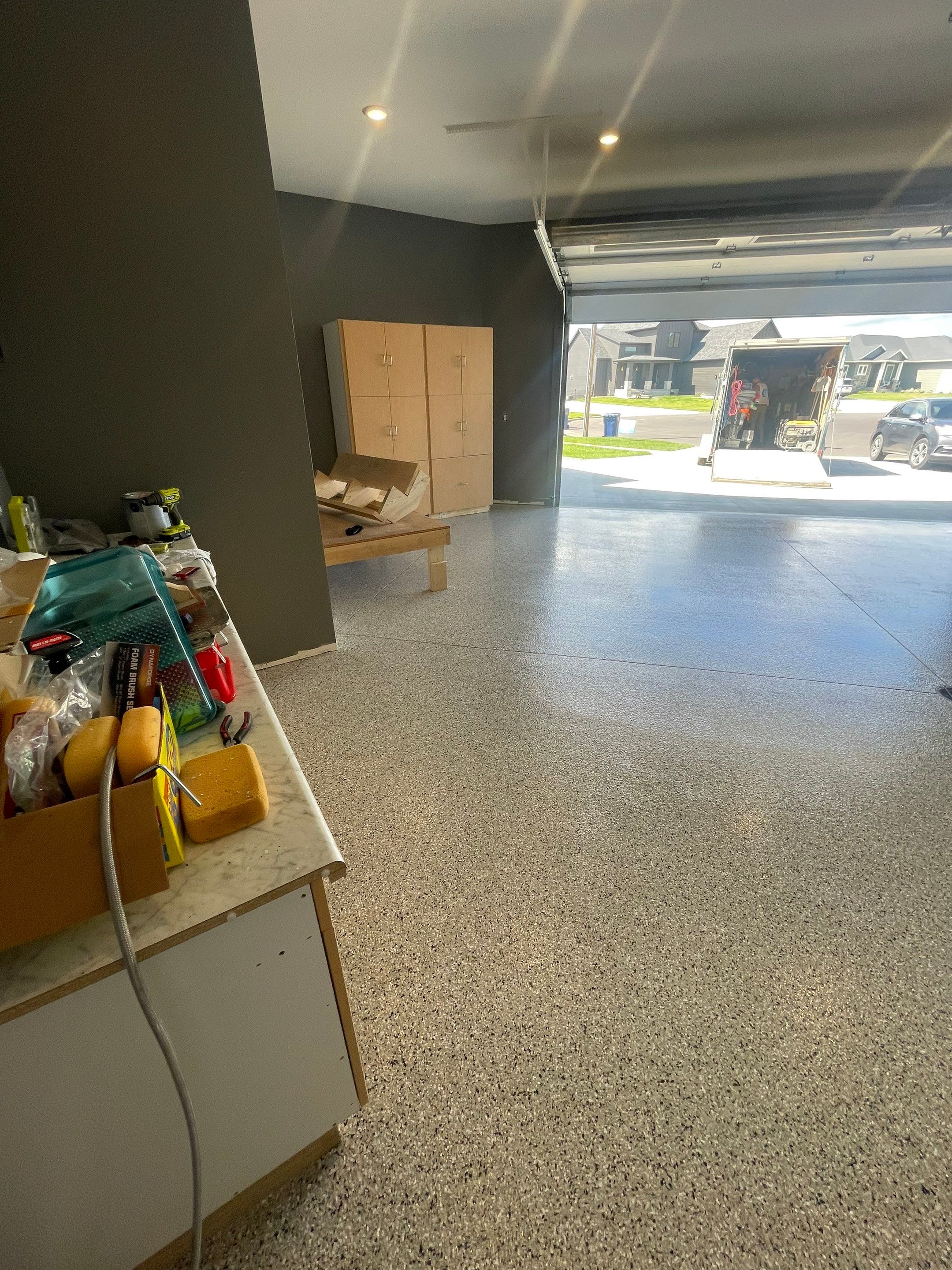 Custom Speckled Concrete Coating for Dell Rapids Garage by Select Painting, Coatings & Garage Cabinets
