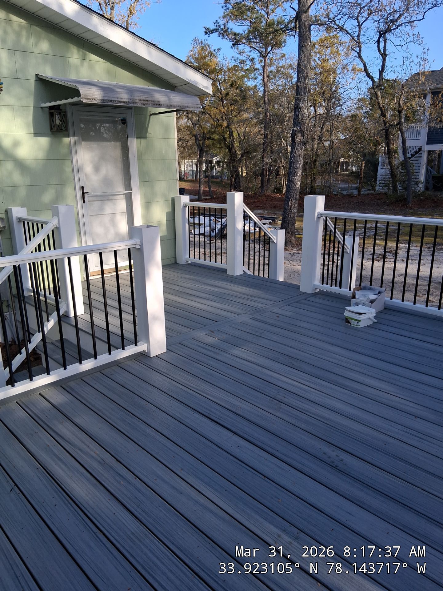 Oak Island Composite Deck Build with Trex Decking and Coastal Railings by RGR Construction and Roofing, LLC
