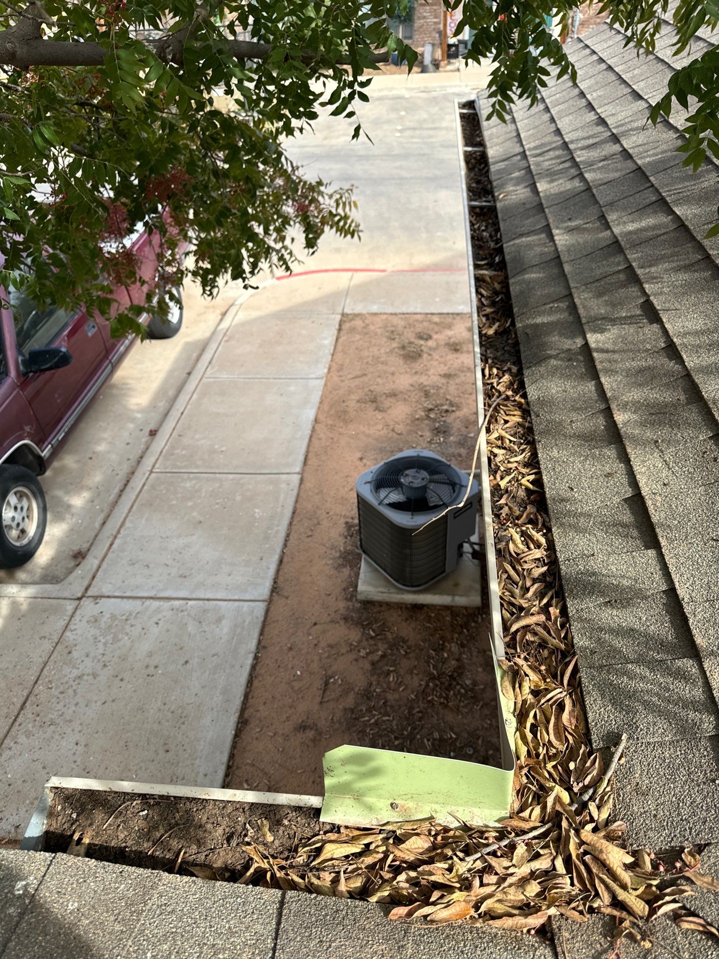 Commercial gutter cleaning Las Cruces, NM a before photo with filled gutters
