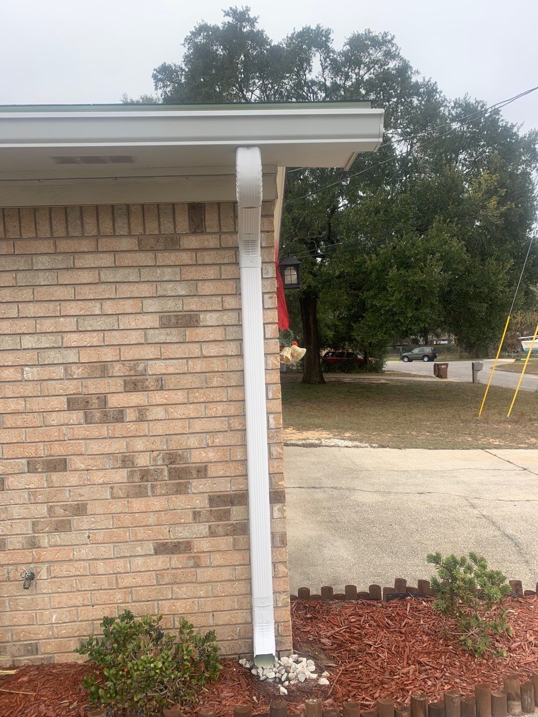 White Seamless Gutter Installation in Milton FL by Gutter Professors