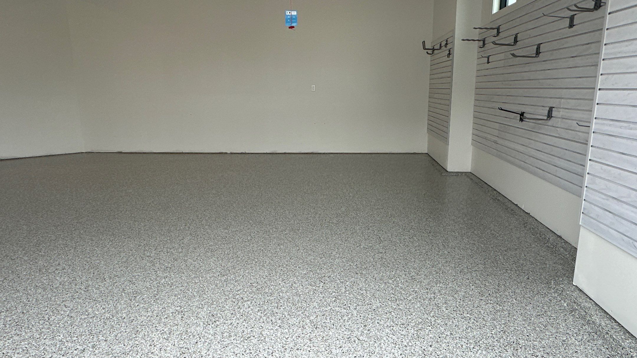 Jon S. transformed his garage with a new floor, slotwall & Cabinets! by Banner Garage