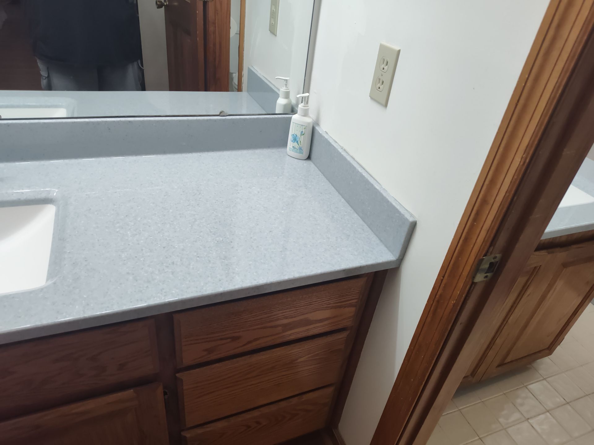Bathroom Remodel using Onyx base and shower walls with seat & caddie by Cornerstone Home Builders, LLC