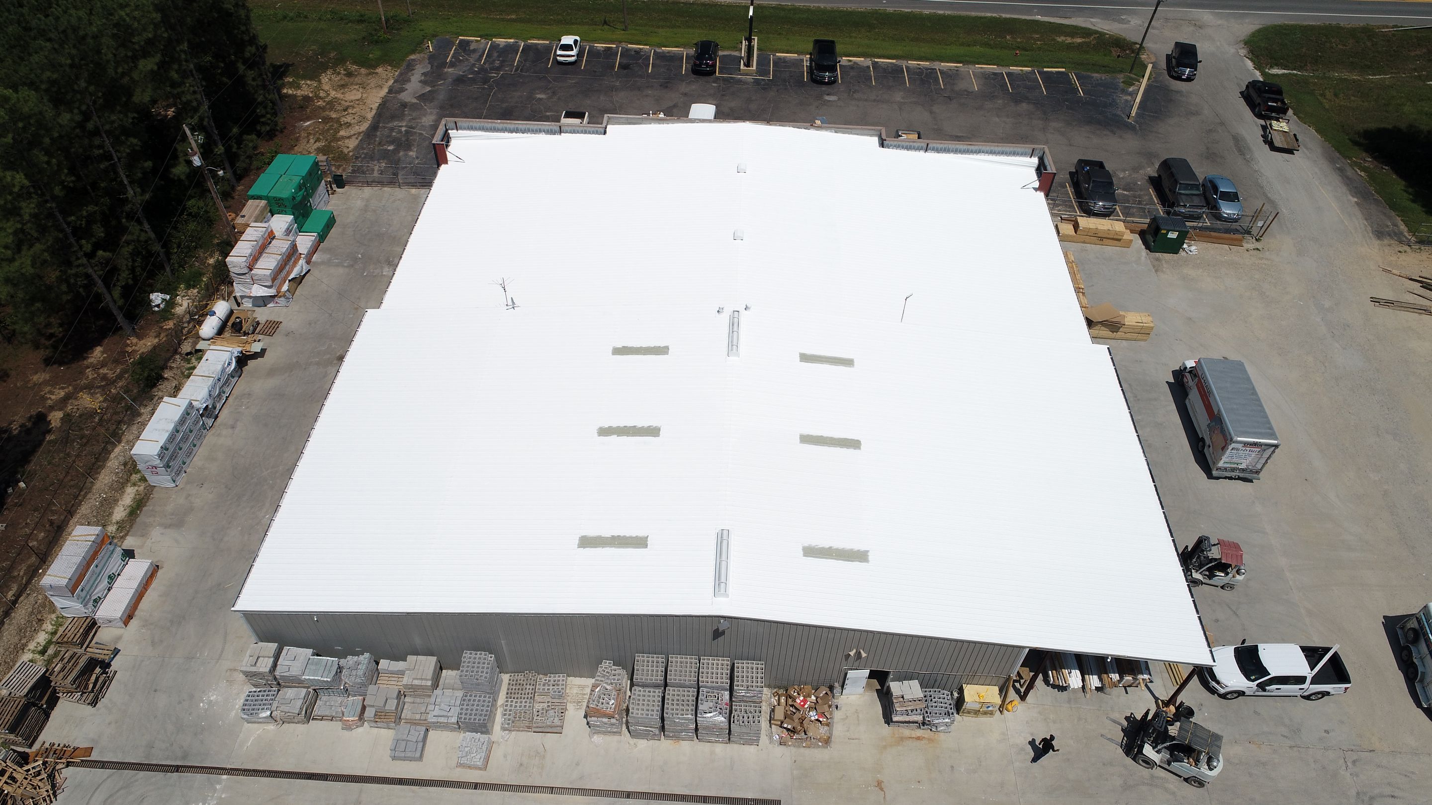 Commercial Roofing Installation using Aldocoat Coatings by Hostetler Roofing
