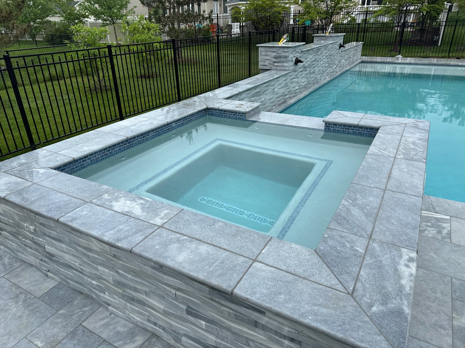 Gunite Pool w/ Spa and Water Features by Elysium Pools