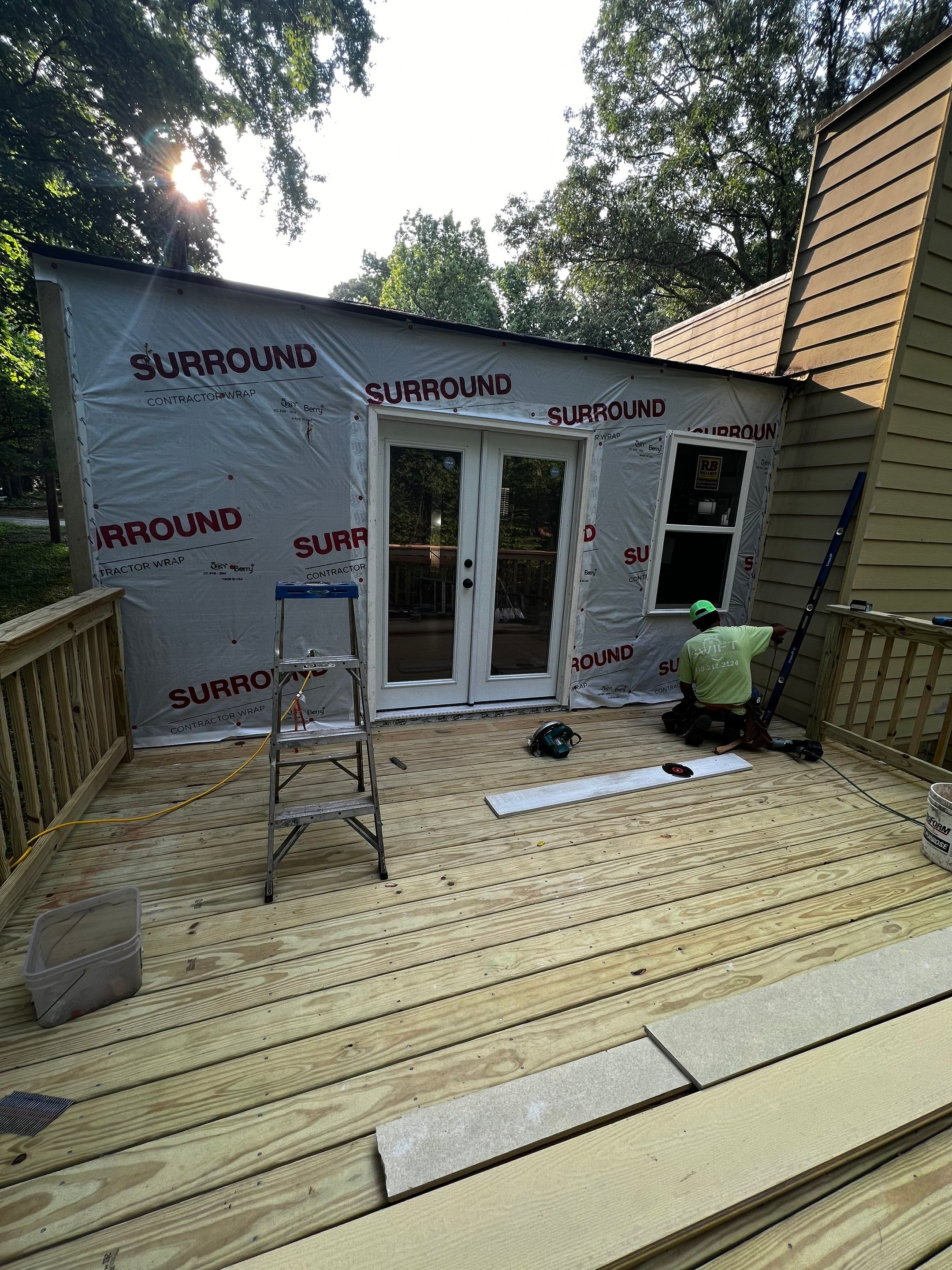 Elevated Wood Deck and Blue Lap Siding Installation in Kennesaw by Swift Home Renovations