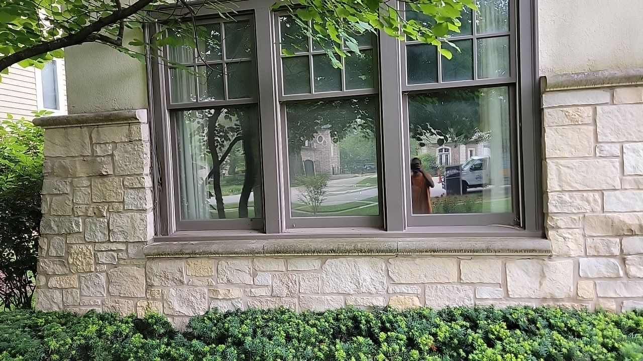 Northbrook, IL stucco home soft wash and stone cleaning by Northern Power Washing LLC.