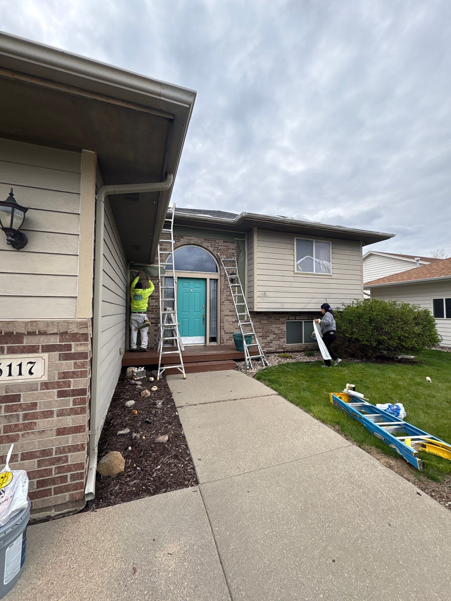 Exterior Painting and Wood Trim Replacement in Sioux Falls by Select Painting, Coatings & Garage Cabinets