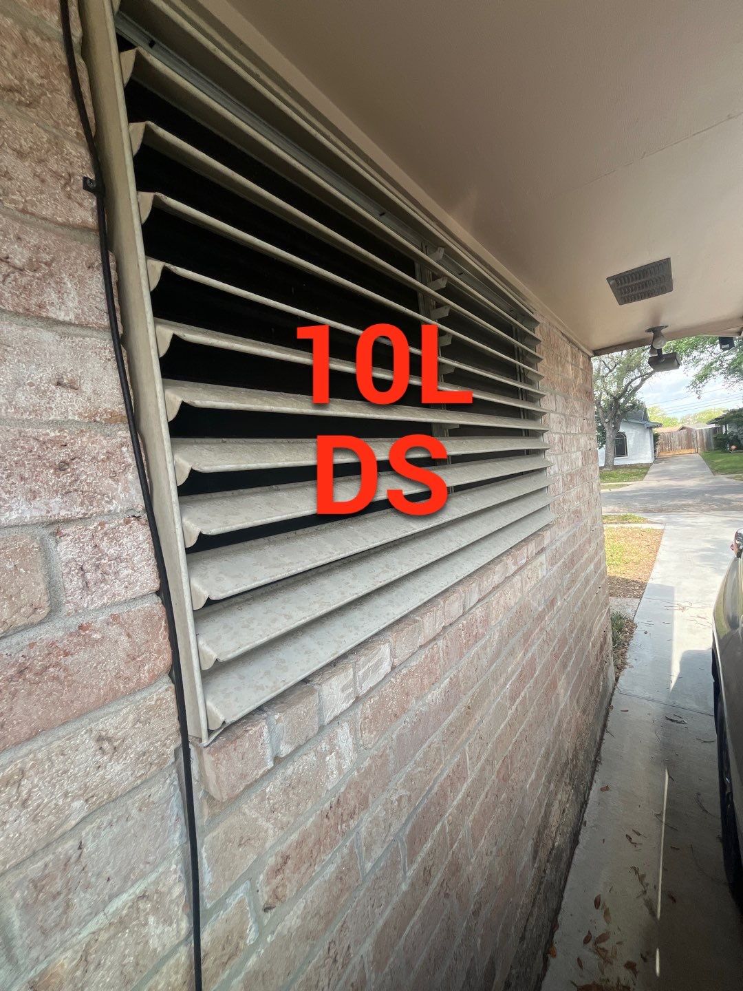 Colored Vinyl Windows to blend into brick by Bayfront Roofing and Construction