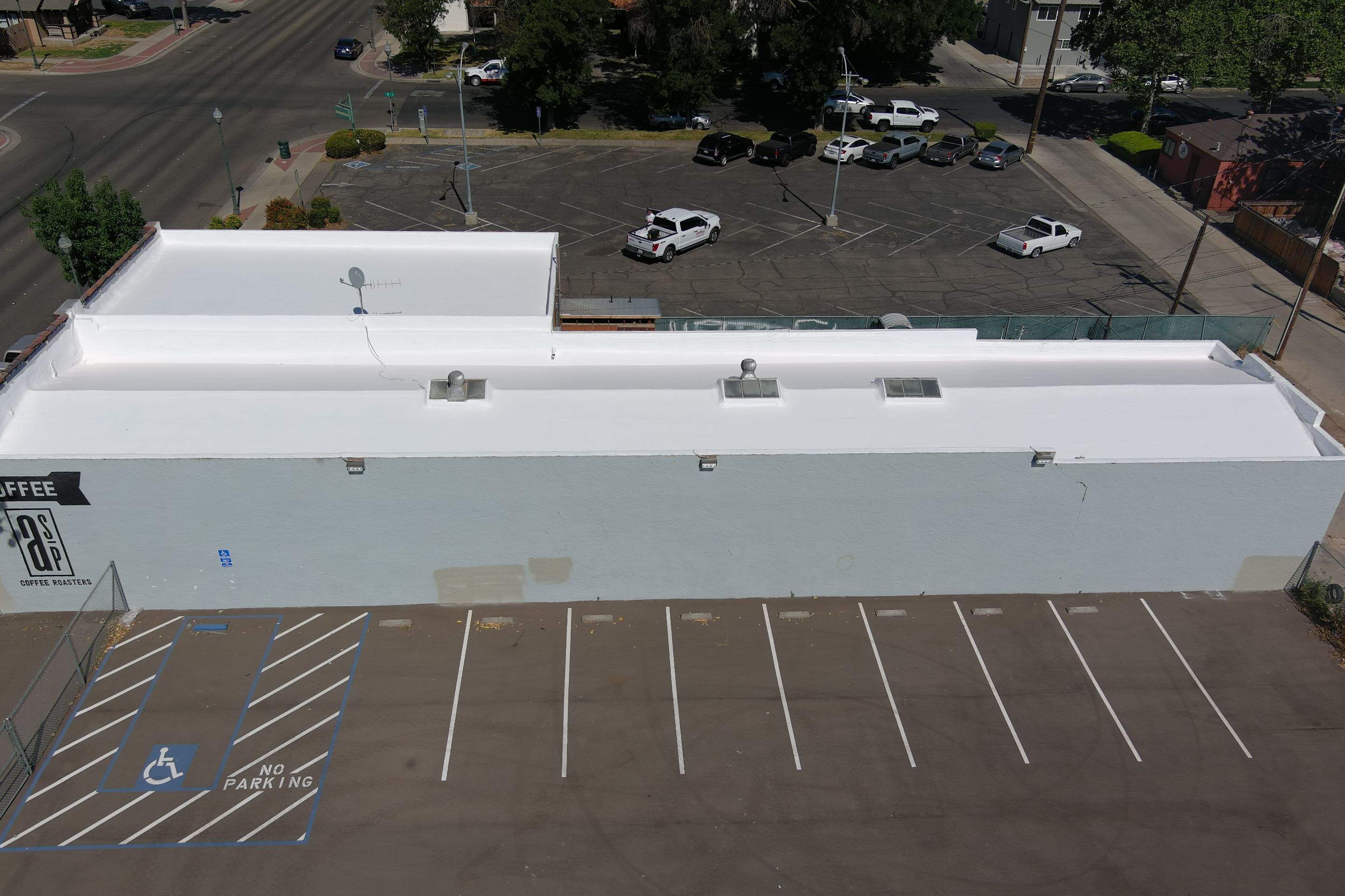 Commercial Roofing Installation using Conklin BenchPly system with PUMA top coat (imbedded fabric system) by Straight Edge Roofing Inc