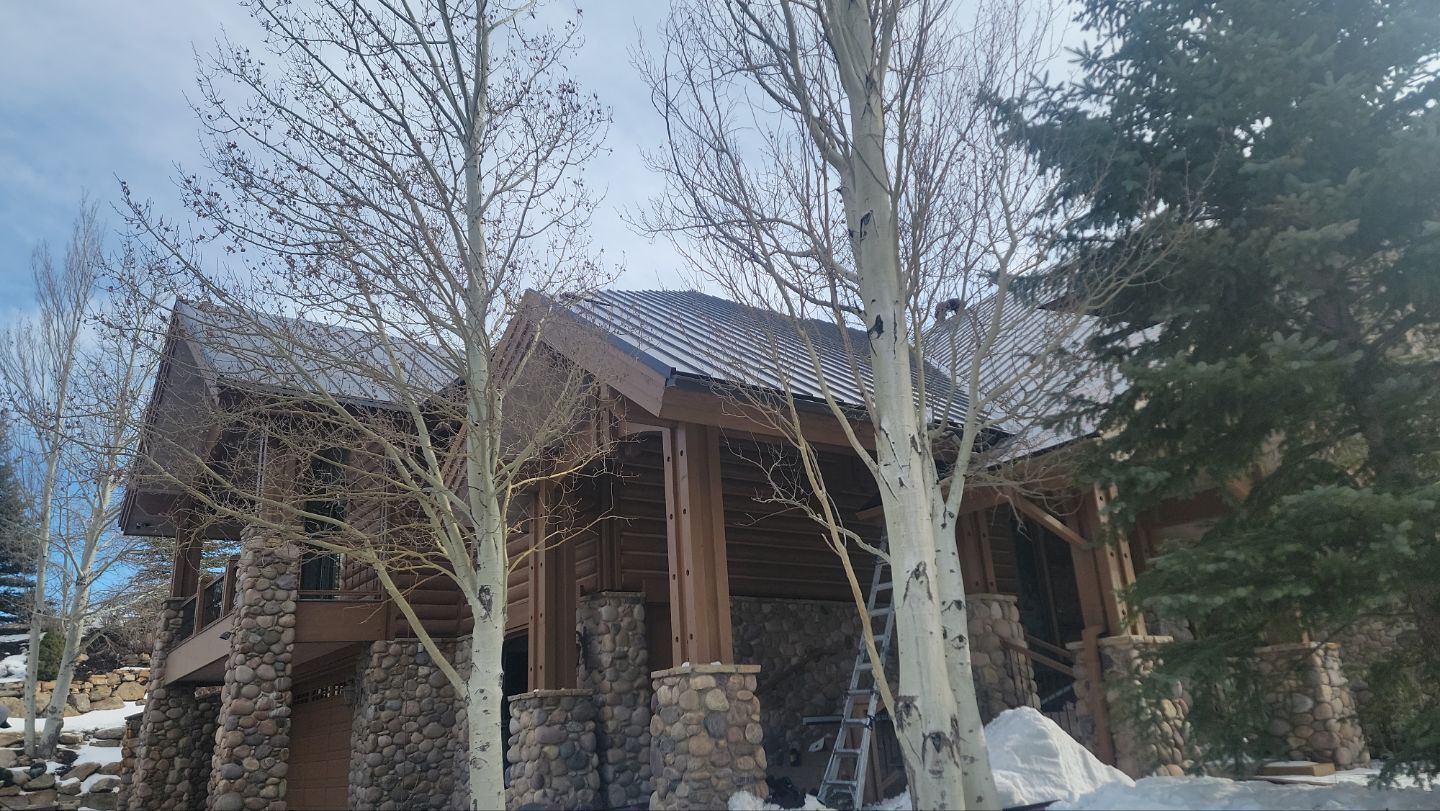 Standing Seam Metal Roof Replacement After Snow Damage by ASAP Roofing & Restoration