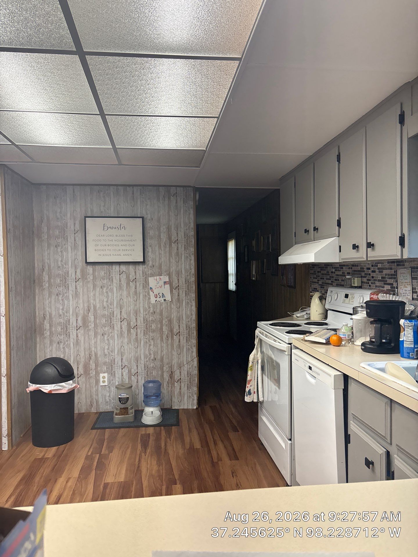 Modernized Kitchen with Gray Painted Cabinets and Tile Backsplash by CompanyCam Sales Demo