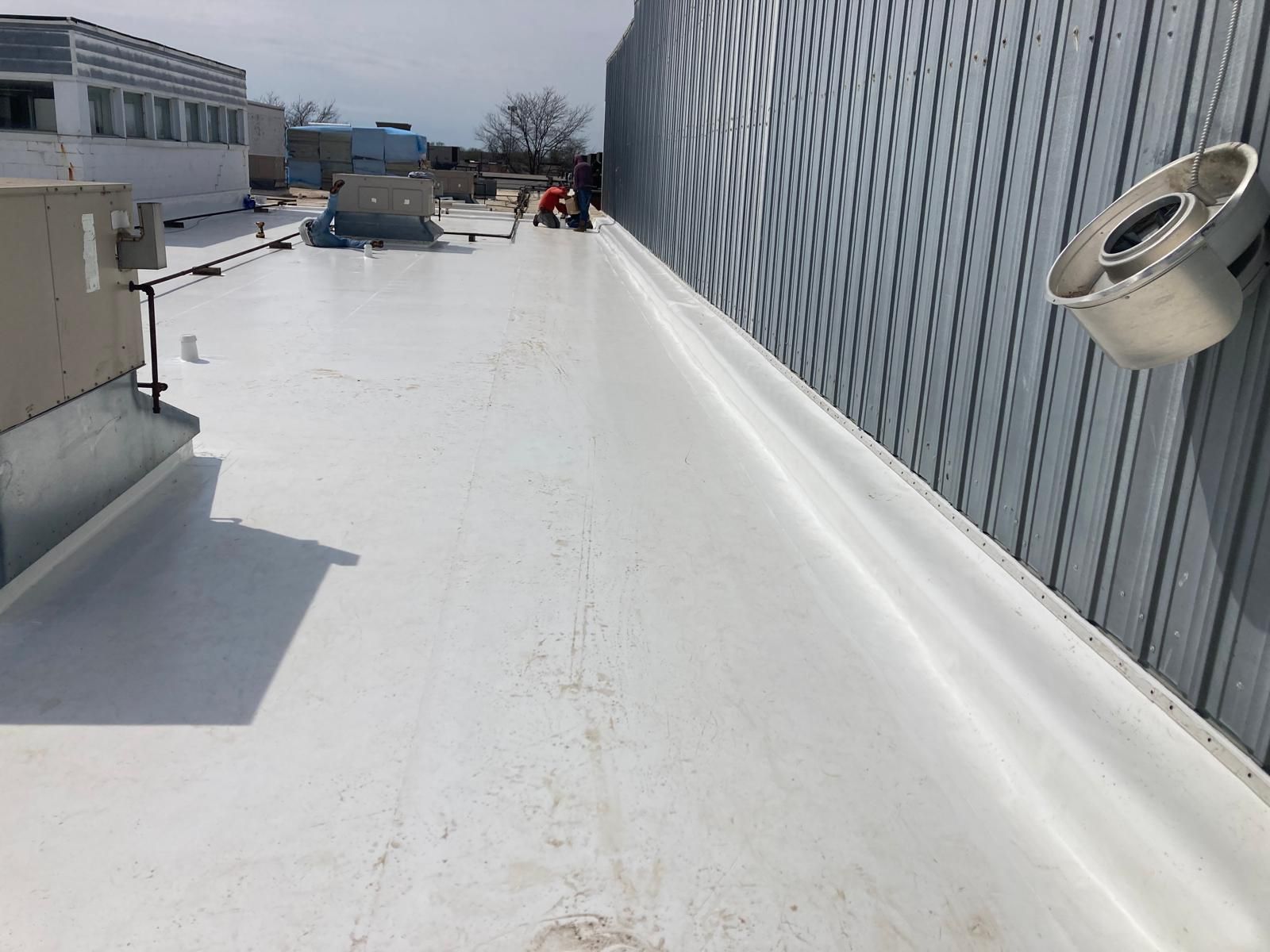 Full Roof Tear-off with new Code ISO insulation and 50 Mil Membrane by Grell Roofing, LLC