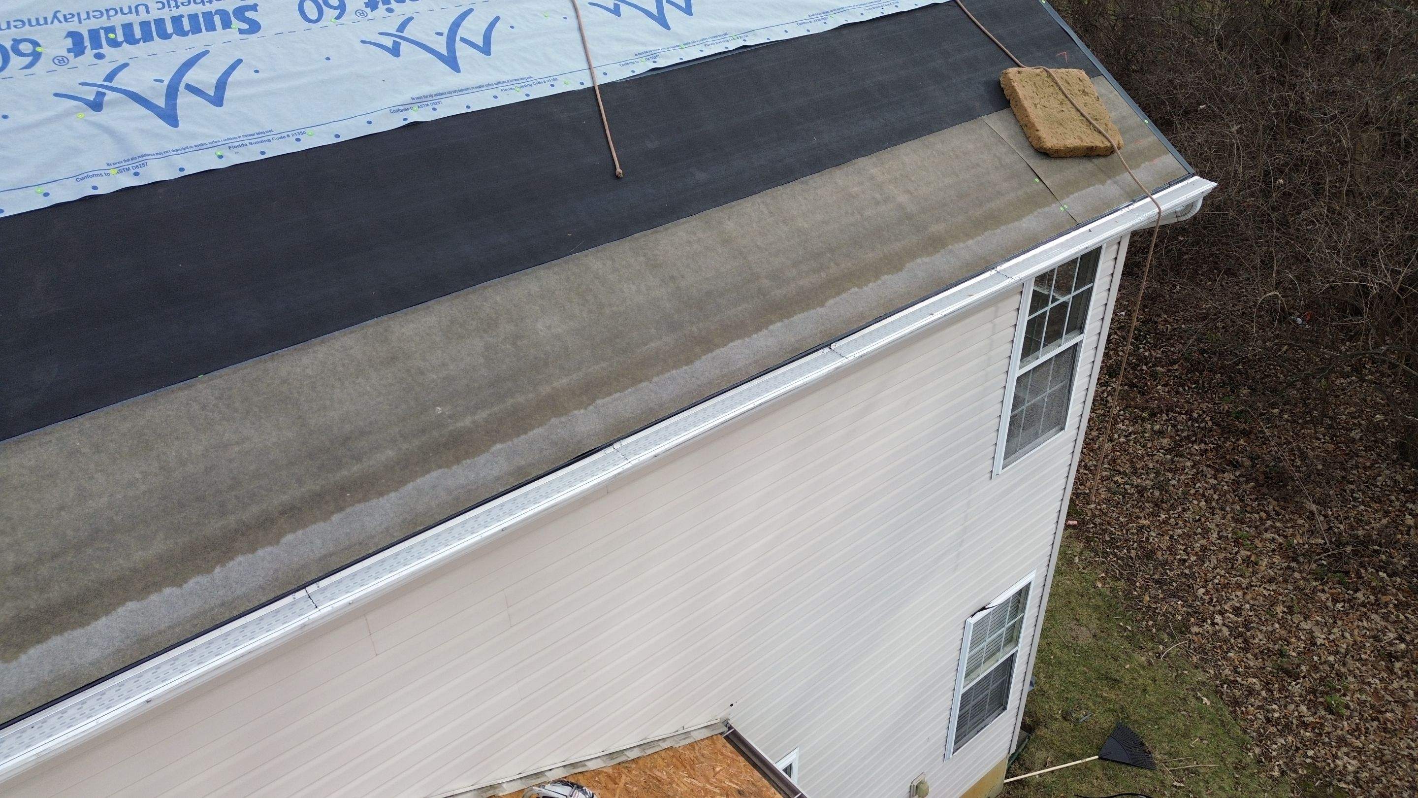 Walden Ponds - Pristine Black and Hydro Flo Gutter Guards by Tamlin Roofing