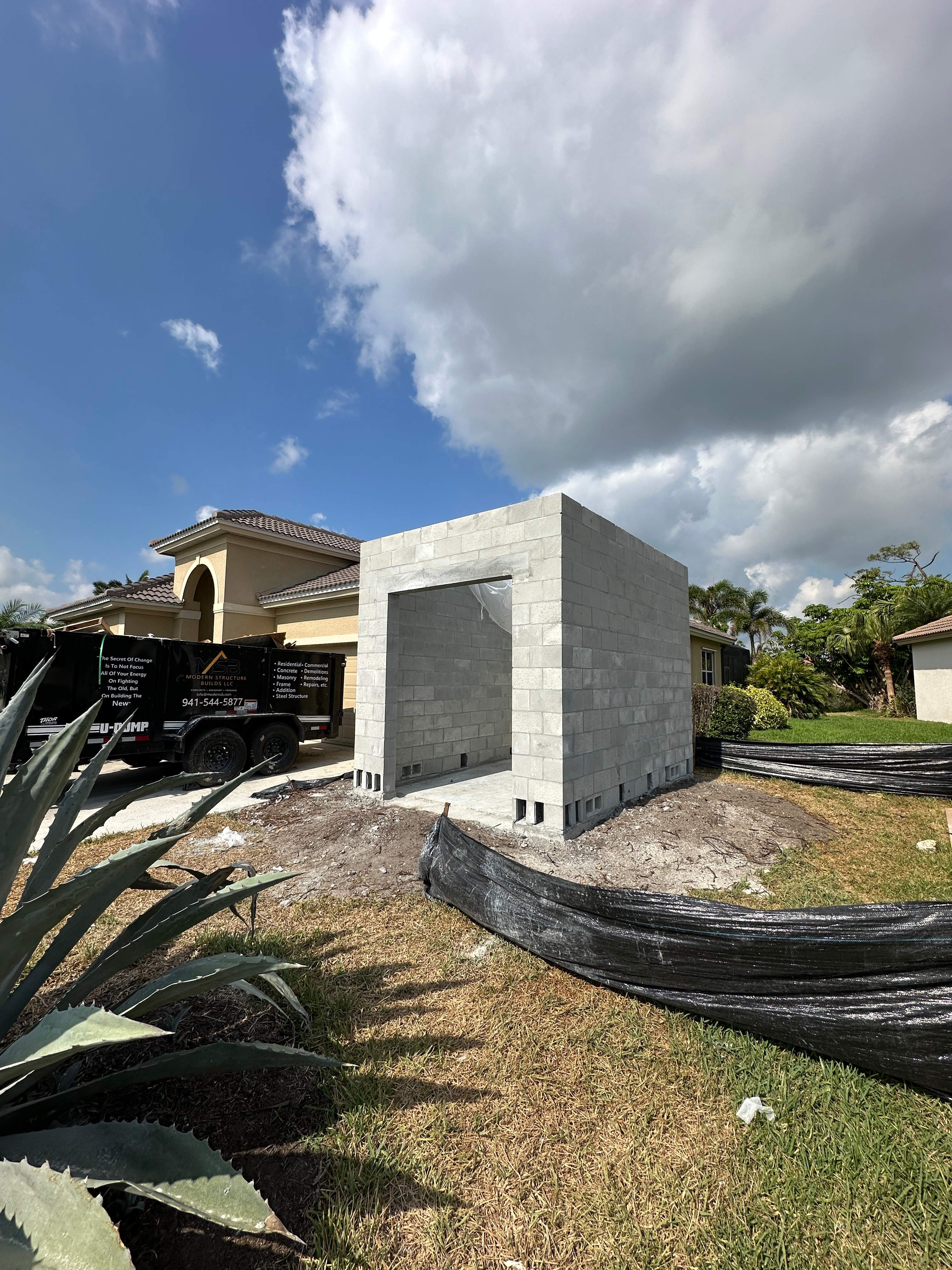 Custom Golf Cart Garage Addition and Paver Driveway in Port Charlotte by Vertical General Contracting 