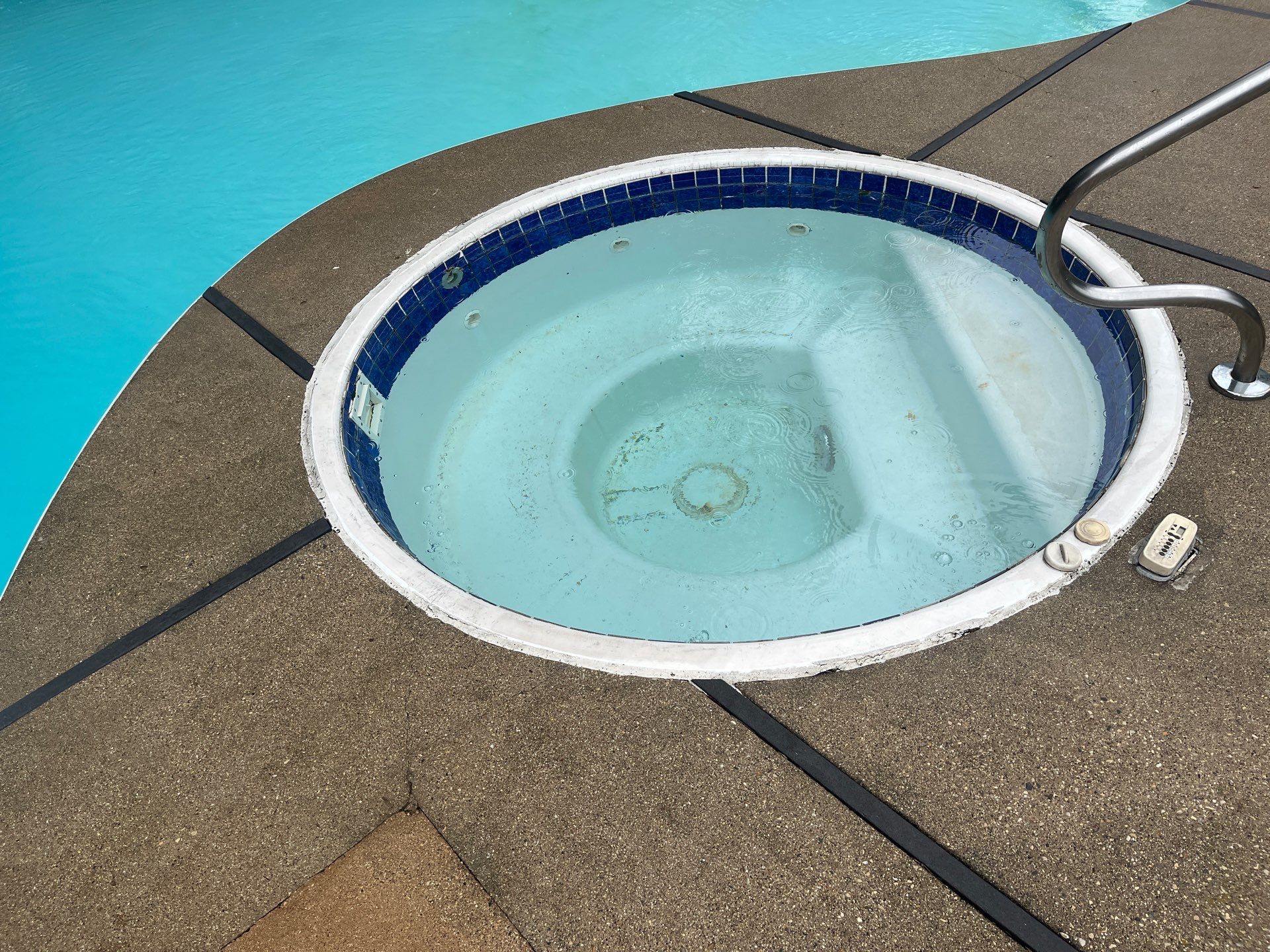 pool deck using Algaecide, soft wash soap by Northern Power Washing LLC.