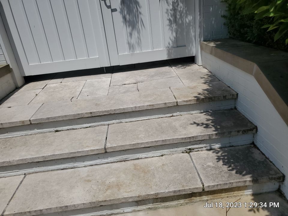 marble patio cleaning and sanding using Polysweep polymeric sand by Northern Power Washing LLC.